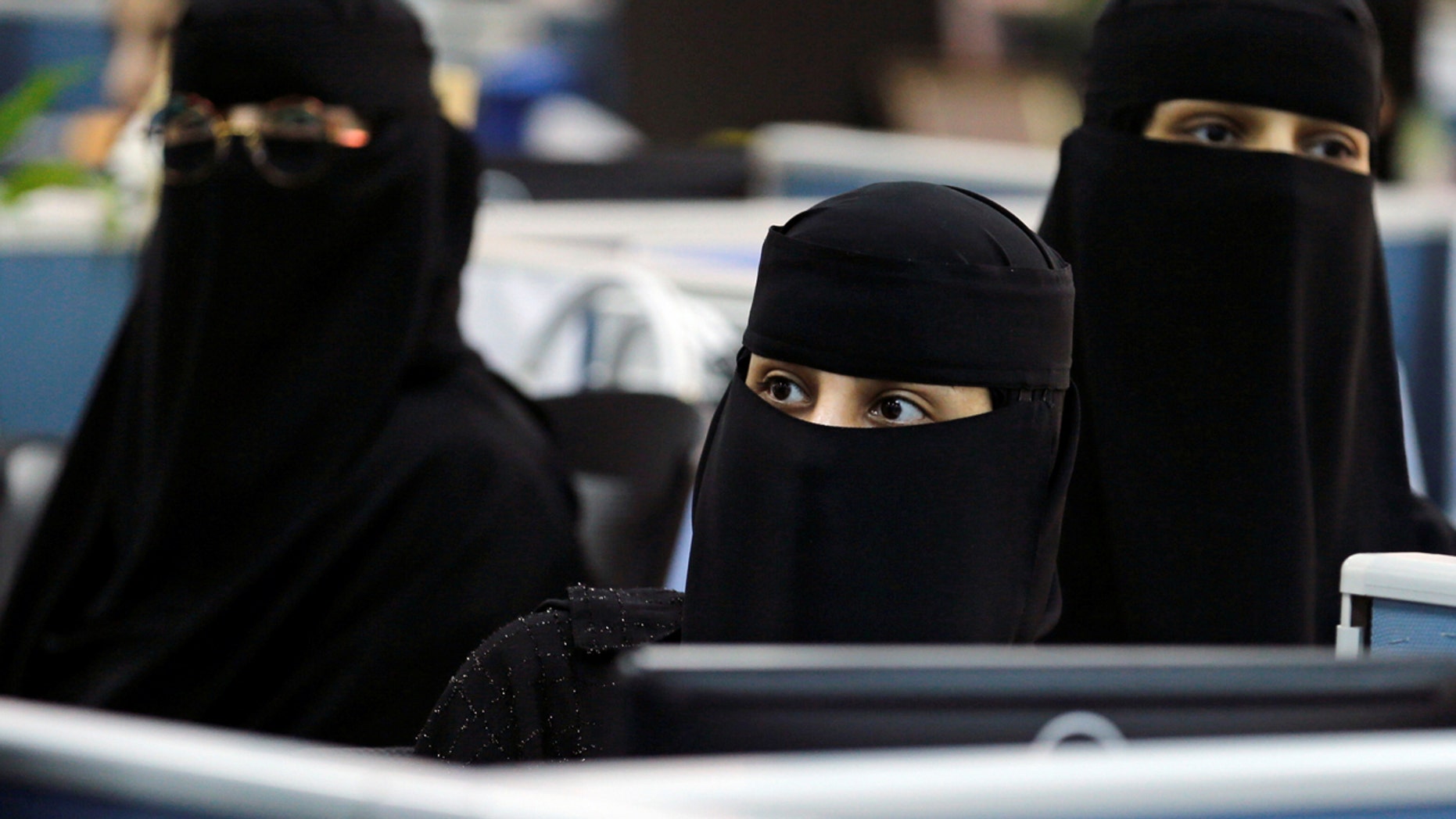 Women sit during a visit by First lady Melania Trump in May in Riyadh.