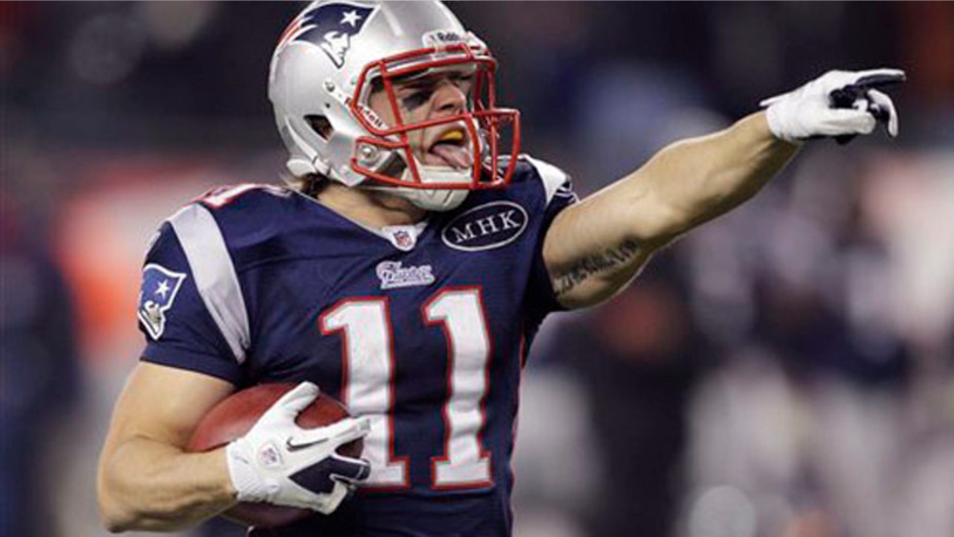 New England Patriots wide receiver Julian Edelman celebrates his 72-yard punt return for a touchdown during the third quarter of an NFL football game against the Kansas City Chiefs in Foxborough, Mass., Monday Nov. 21, 2011.