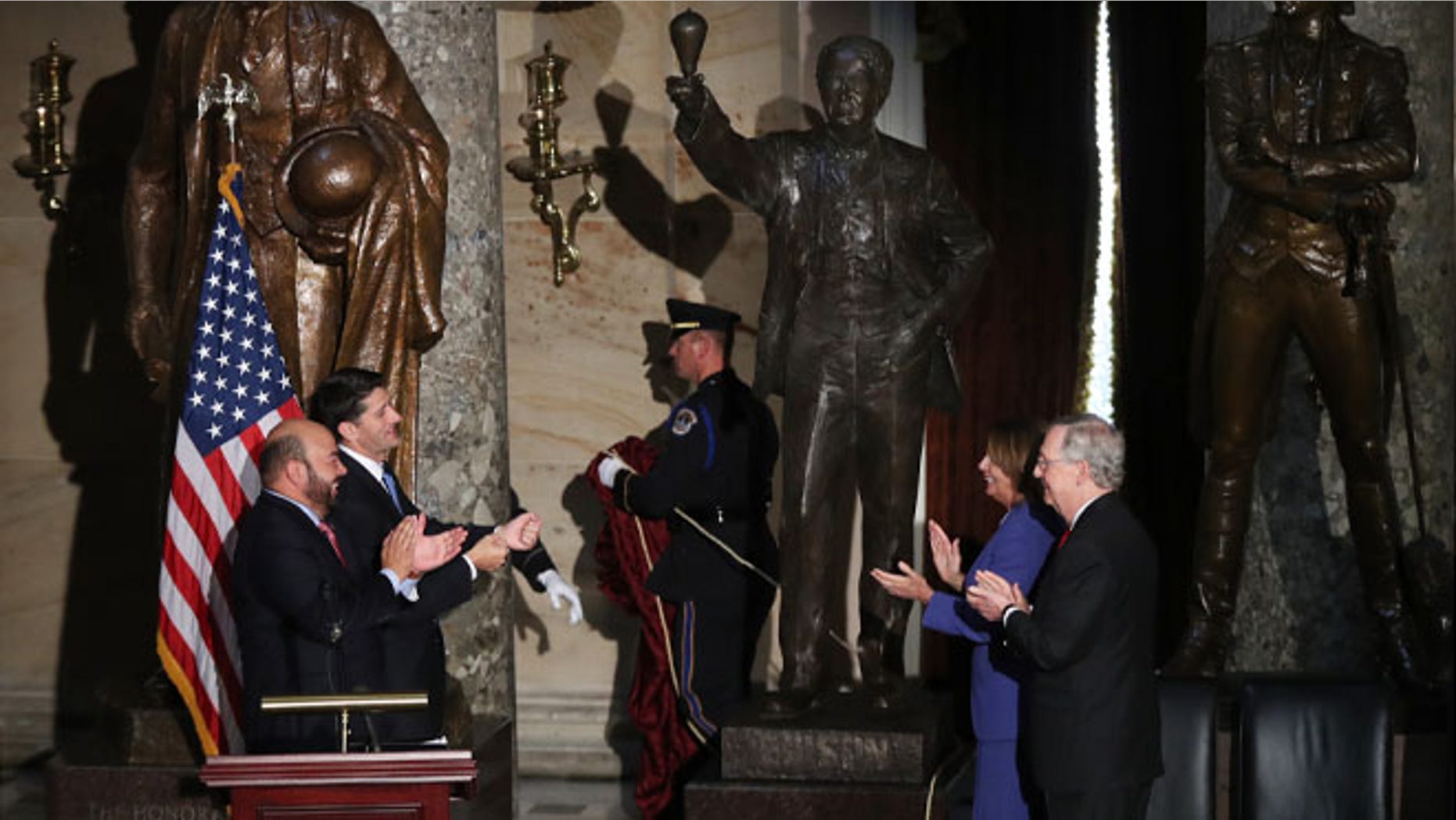 From left, Ohio House of Representatives Speaker Cliff Rosenberger, House Speaker Paul Ryan of Wis., House Minority Leader Nancy Pelosi of Calif., and Senate Majority Leader Mitch McConnell of Ky., applaud during the unveiling of the statue of Thomas Edison in Statuary Hall on Capitol Hill in Washington, Wednesday, Sept. 21, 2016. (AP Photo/Manuel Balce Ceneta)