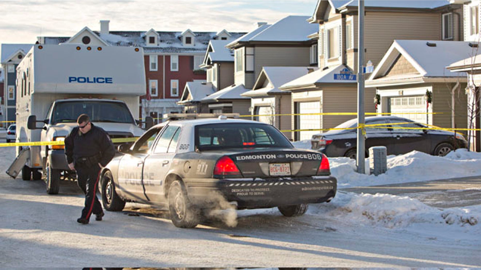 Dec. 30, 2014: Police investigate the scene where multiple deaths occurred overnight in Edmonton, Alberta. (AP)
