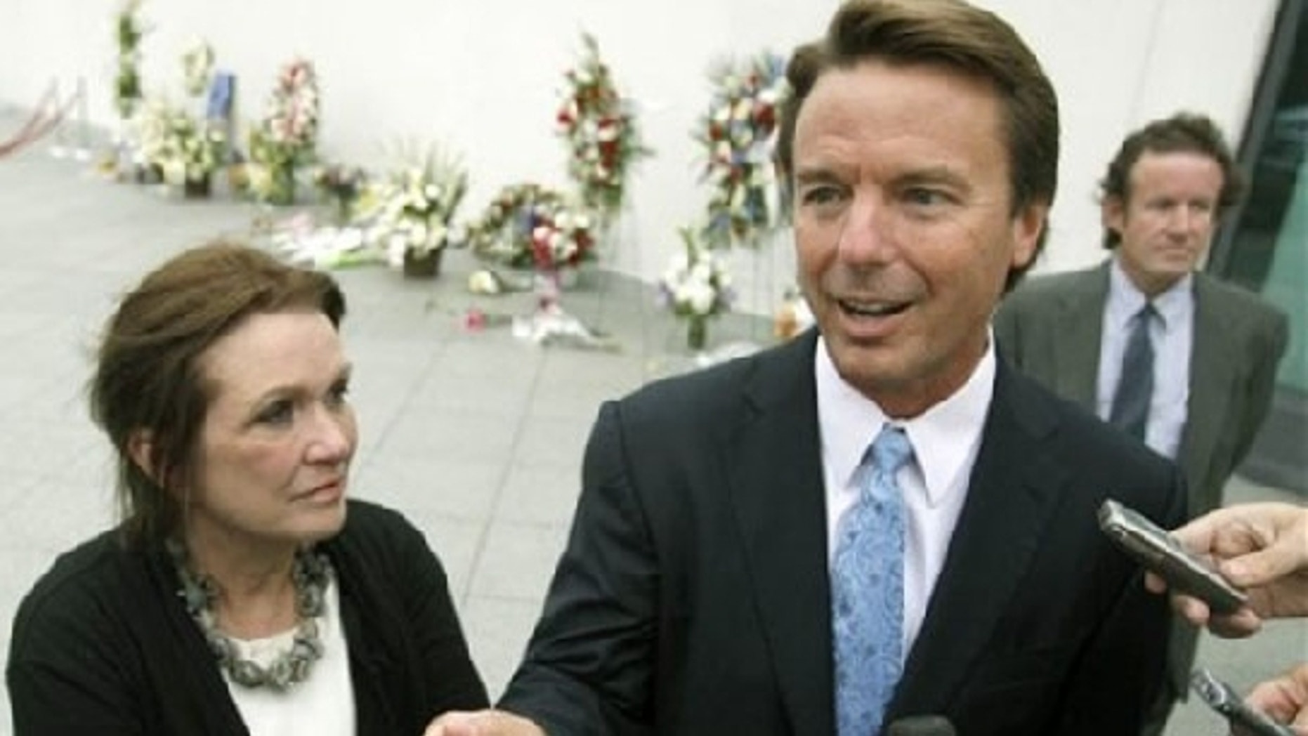 Aug. 28, 2009: Speaking of standing by her man, Elizabeth Edwards joins former Sen. John Edwards at a memorial service in Boston for the late Sen. Edward Kennedy. (AP Photo)
