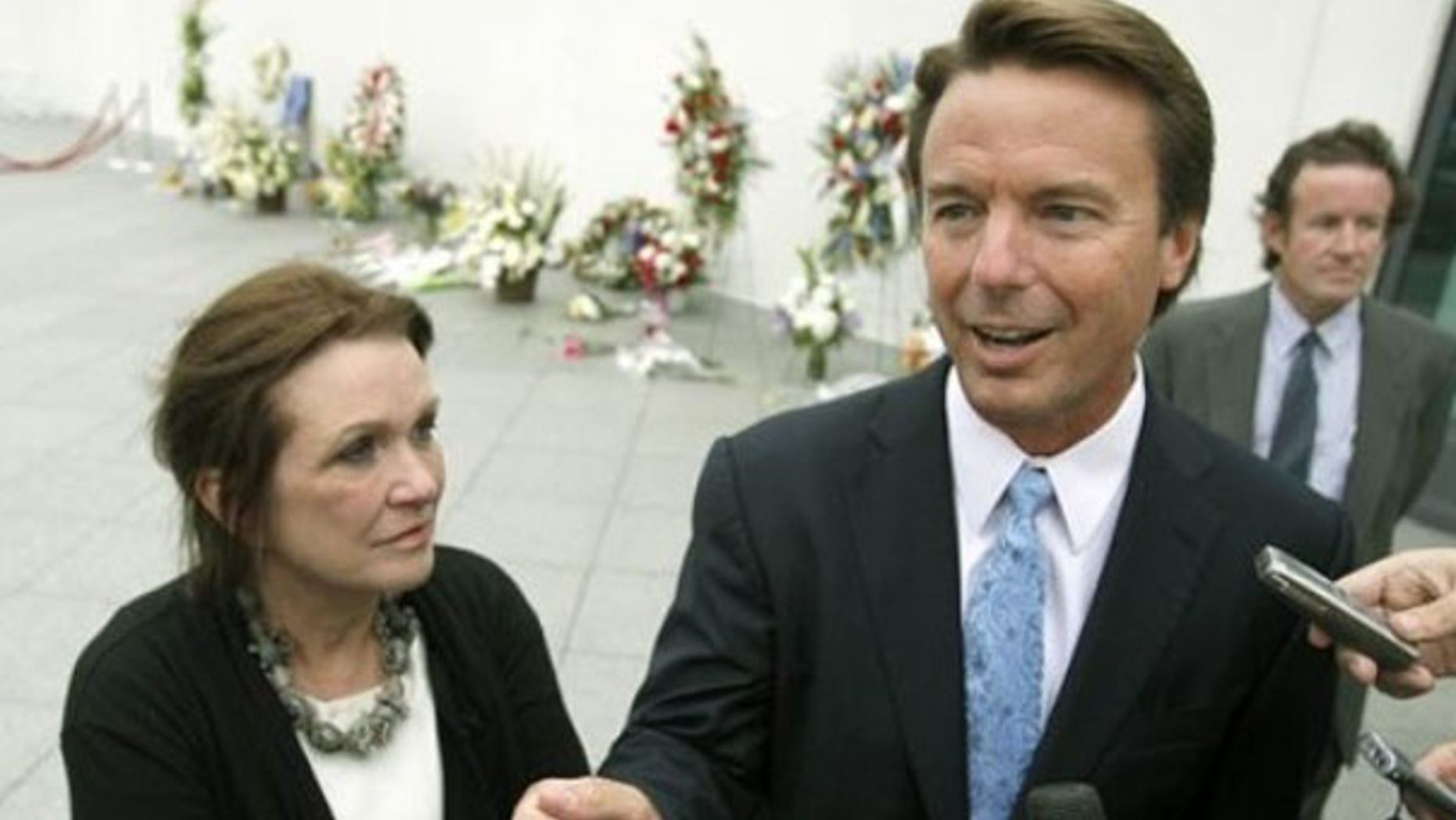 Former Sen. John Edwards arrives with his wife Elizabeth for the late Sen. Edward Kennedy's memorial service in Boston Aug. 28, 2009. (AP Photo)