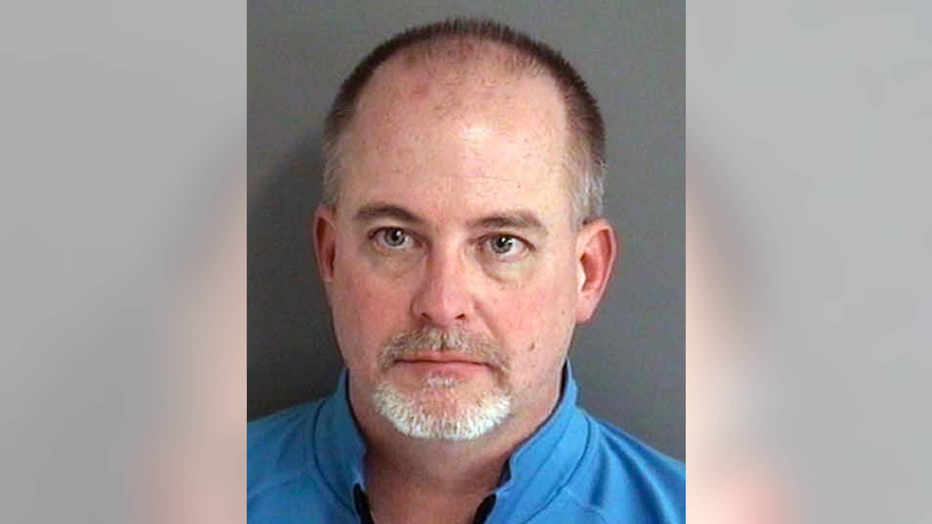 FILE - In this an. 24, 2017, file photo provided by the Story County Sheriff's Office in Ames, Iowa shows John McPhee. McPhee, a former Iowa fire academy administrator, pleaded guilty Wednesday, April 26, 2017, to falsifying test scores that were used to improperly certify thousands of firefighters. (Story County Sheriff's Office via AP, File)