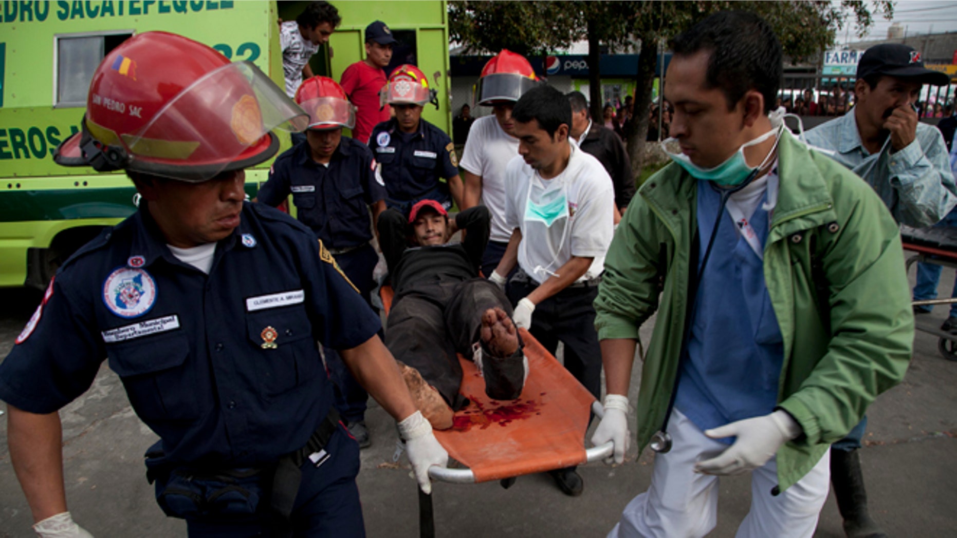 Nov. 7, 2012: Firefighters transport a wounded resident into a public hospital after he was injured in a magnitude 7.4 earthquake that struck in San Marcos, Guatemala.