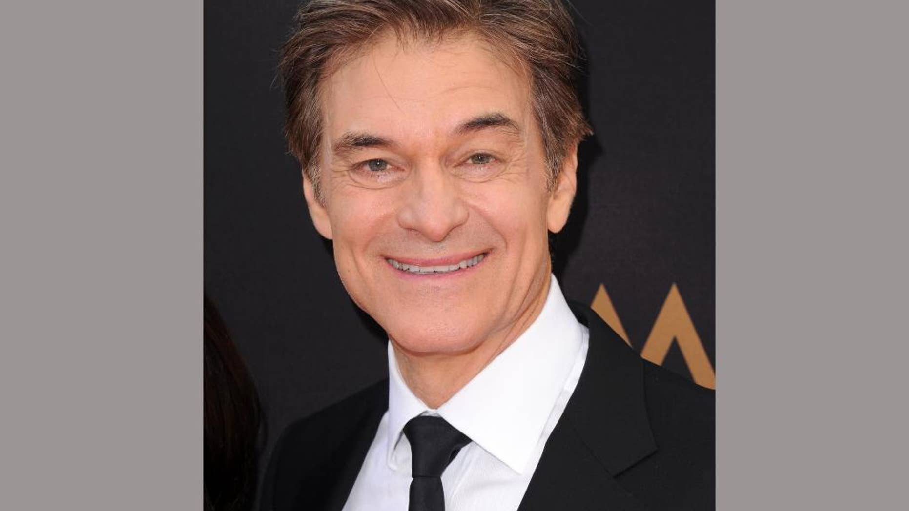 FILE - In this May 1, 2016 file photo, Dr. Mehmet Oz arrives at the 43rd annual Daytime Emmy Awards in Los Angeles. Oz is partner in a new venture called JungoTV, announced Monday, June 6, that will attempt to give immigrants online access to popular television programs from their home countries. (Photo by Richard Shotwell/Invision/AP, File)