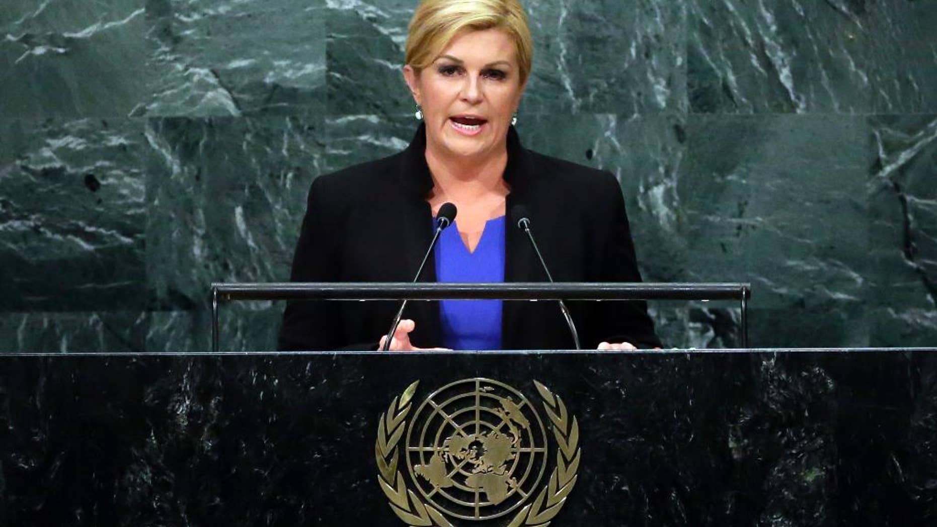 FILE - In this Wednesday, Sept. 21, 2016 file photo, Croatia's President Kolinda Grabar-Kitarovic addresses the 71st session of the United Nations General Assembly, at U.N. headquarters. Under pressure from nationalists, the Croatian president has issued a public apology for earlier this week handing out packages of sweets that included Serbia-made chocolate to Croatian children in Dubrovnik, the ancient Adriatic Sea resort attacked and damaged by the Serb-led Yugoslav army in 1991. (AP Photo/Richard Drew, File)