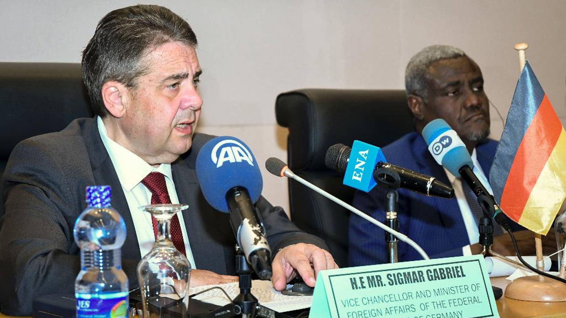 Germany's Foreign Minister Sigmar Gabriel, left, speaks to media accompanied by African Union (AU) chairman Moussa Faki Mahamat, at the AU headquarters in Addis Ababa, Ethiopia Tuesday, May 2, 2017. Germany's foreign minister and the African Union chief say setting up camps in North Africa will not solve Europe's migrant crisis and that stabilizing African countries is a better strategy. (AP Photo/Daniel Getachew)