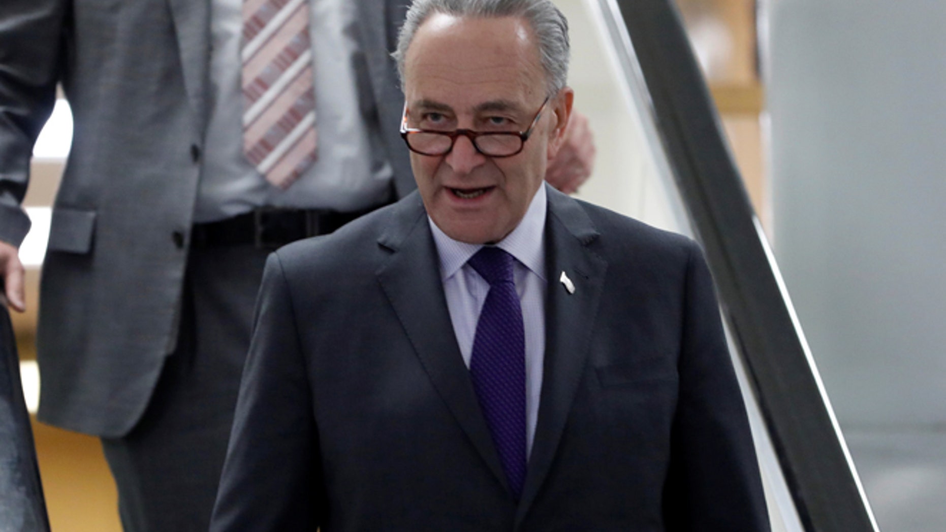 FILE: Senate Minority Leader Chuck Schumer praised the new sanctions.