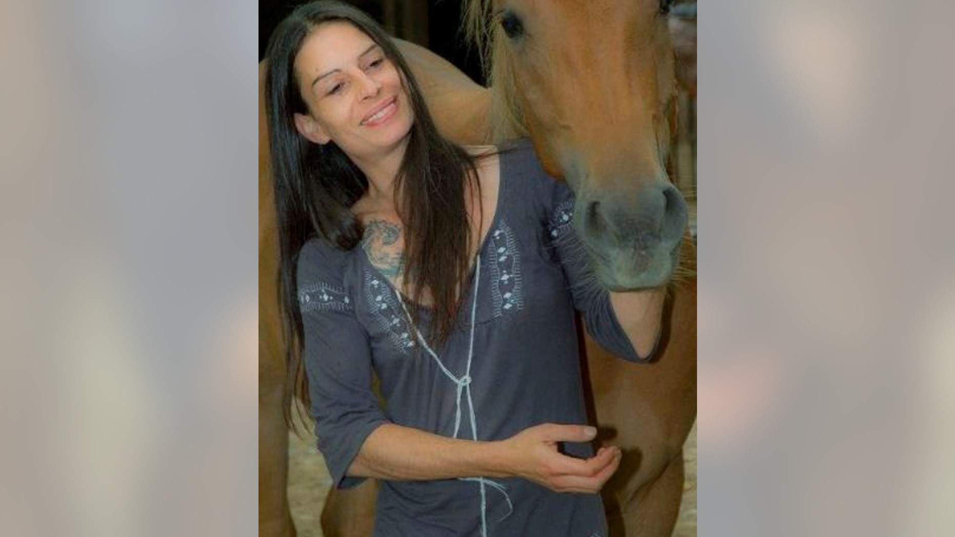 In this photo released by the Spanish Police on Thursday Jan. 23, 2014, 40-year-old Swiss citizen Katharina Katit-Staheli is pictured at an unknown date and location. Spanish authorities allege the Swiss woman detained by police in Torrevieja on the Mediterranean coast killed her 10-month-old baby by cutting its throat and then tried to kill herself on Wednesday Jan. 22, 2014. The mother allegedly took her child, who suffered from a brain abnormality, without authorization from a specialist Swiss clinic and fled to Spain. AP Photo/Spanish Police)