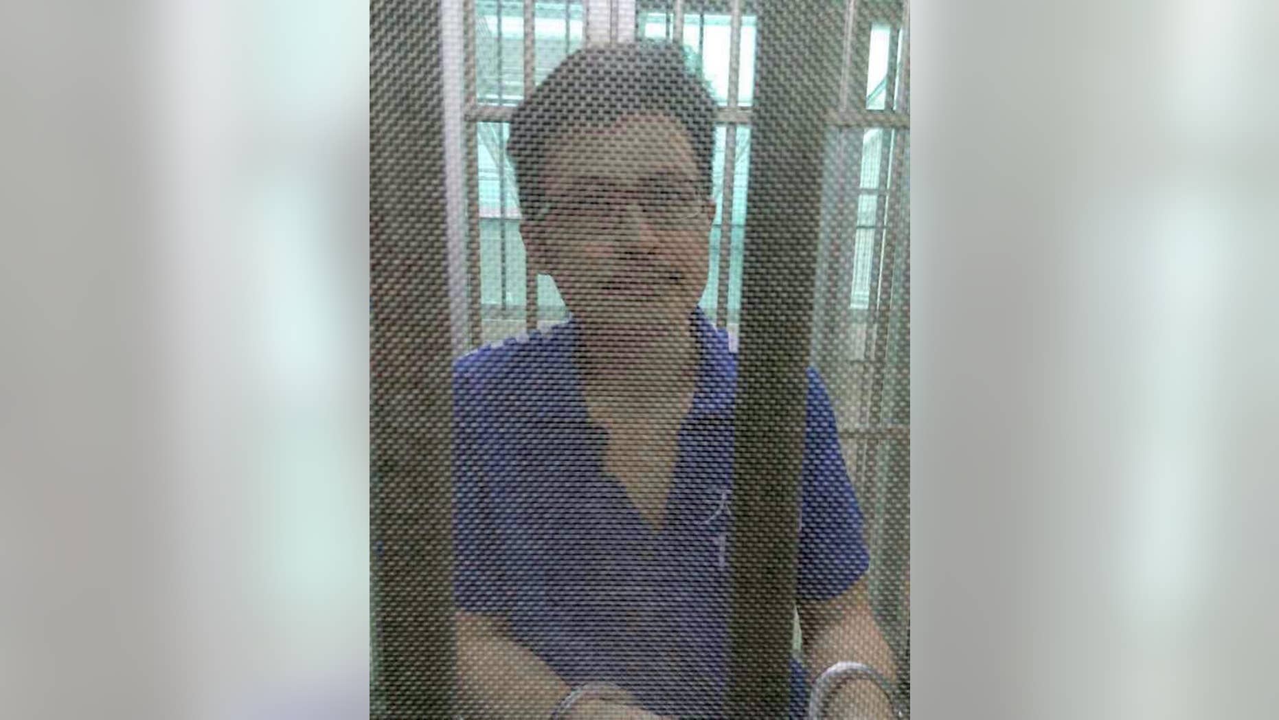 In this December 2014 photo, Yang Maodong, better known by his penname Guo Feixiong, sits in a detention center in Guangzhou in southern China's Guangdong province. The sister of a prominent imprisoned Chinese political activist said Friday, May 6, 2016, that she fears her brother is seriously ill and is urging the authorities to allow him access to better medical treatment, in what an international rights group said is the latest example of China routinely denying political prisoners adequate care. (AP Photo) NO SALES