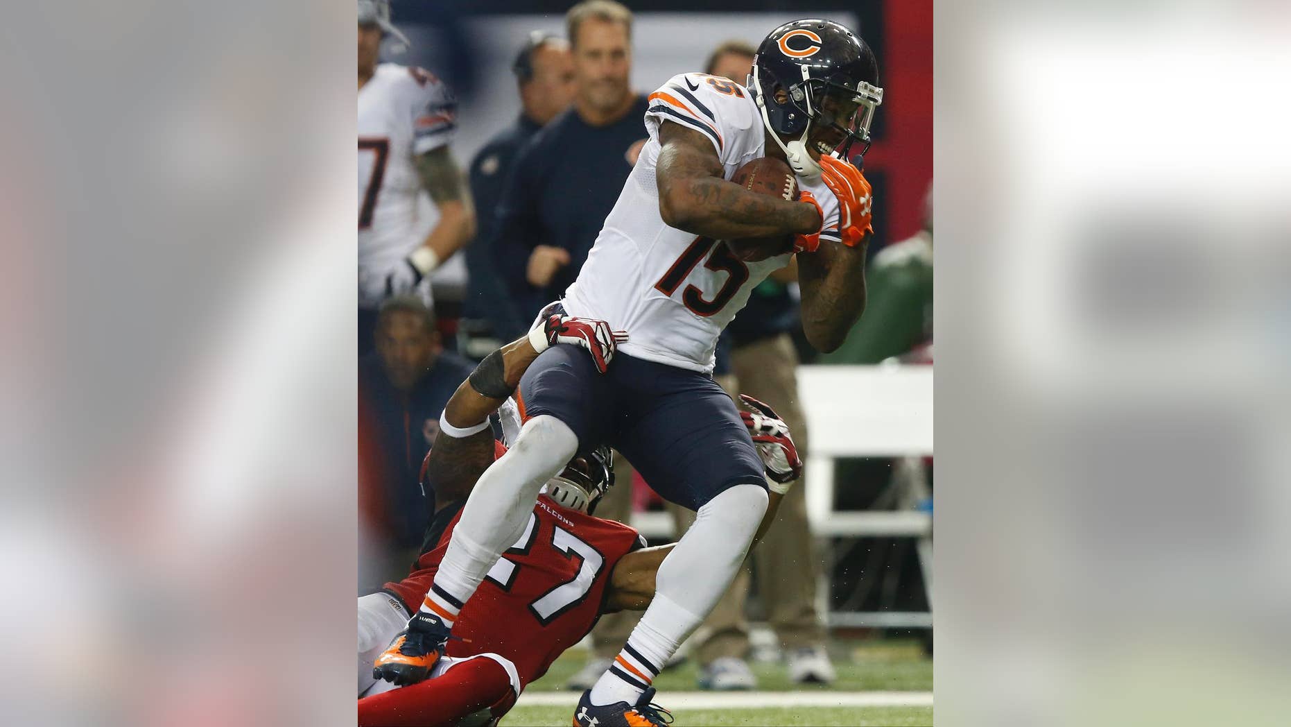 Chicago Bears wide receiver Brandon Marshall (15) works against Atlanta Falcons cornerback Robert McClain (27) during the first half of an NFL football game, Sunday, Oct. 12, 2014, in Atlanta. (AP Photo/Brynn Anderson )