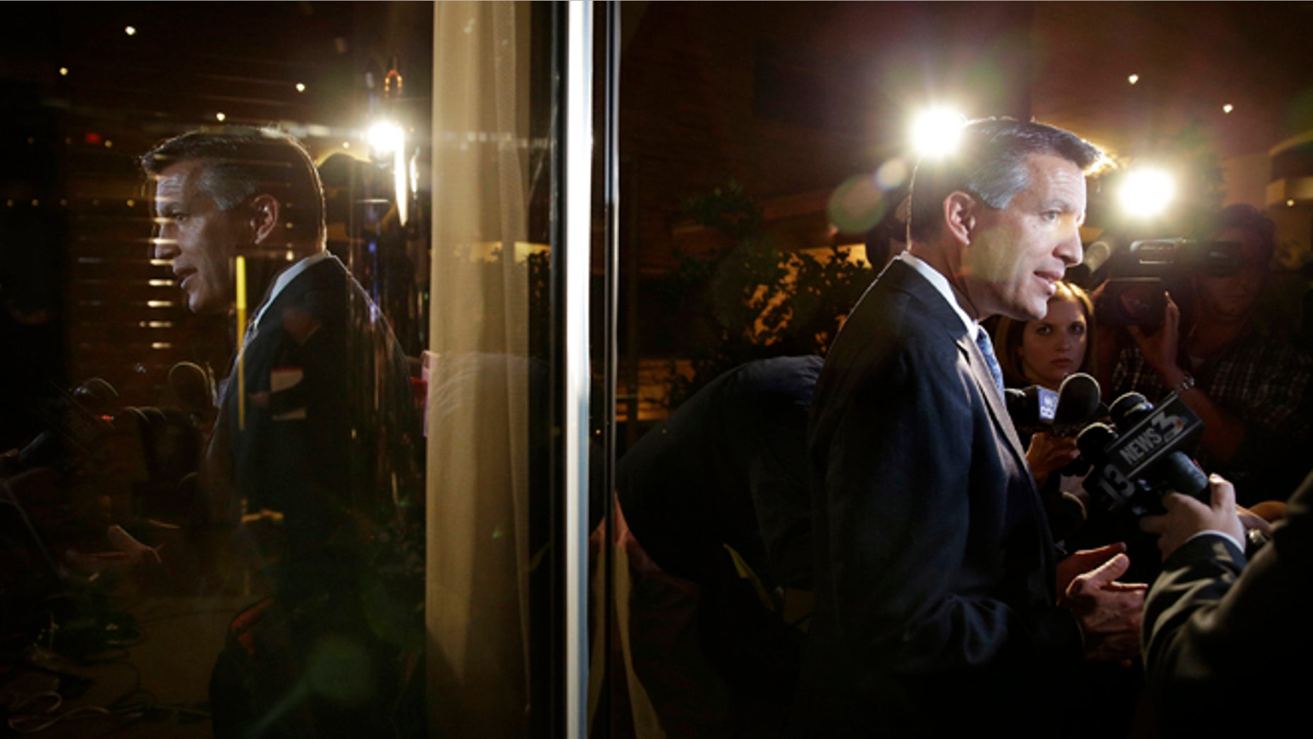 Nevada Gov. Brian Sandoval speaks with members of the media at a Republican victory party Tuesday, Nov. 4, 2014, in Las Vegas. Sandoval defeated Bob Goodman to stay governor of Nevada. (AP Photo/John Locher)