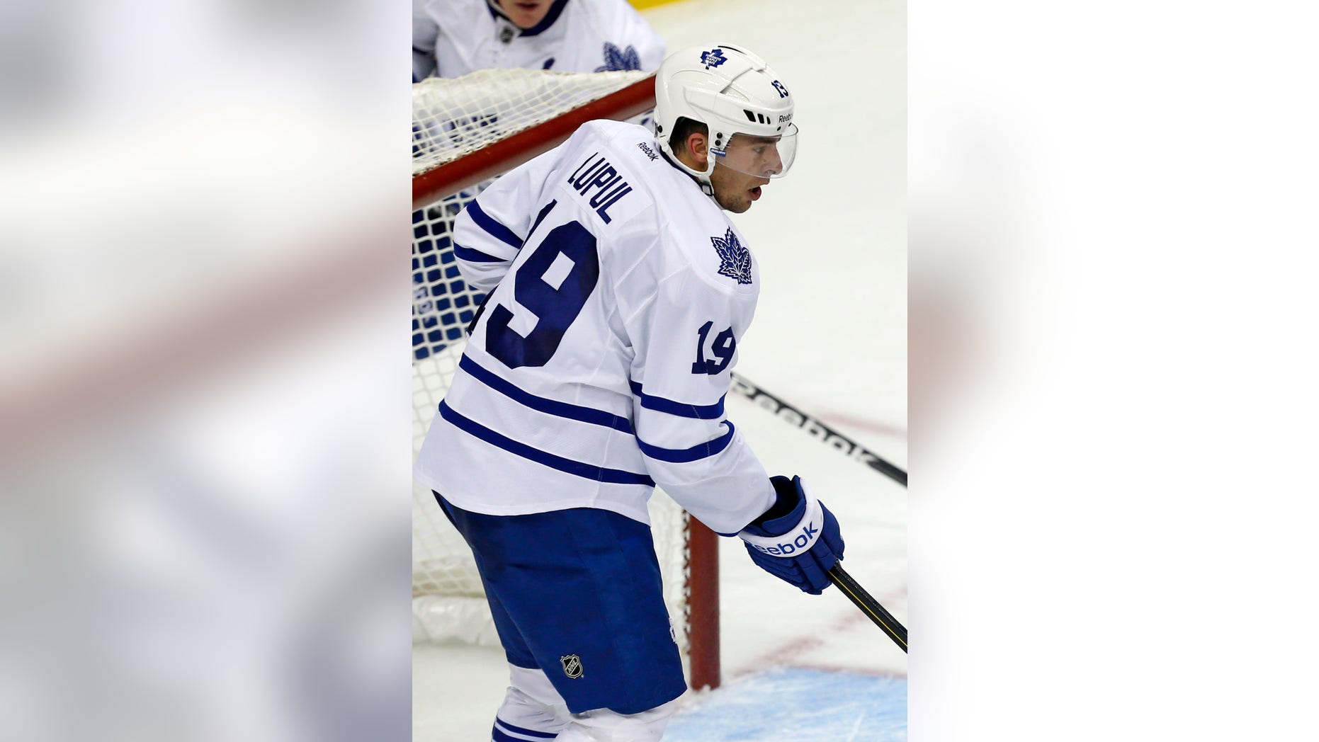 Toronto Maple Leafs right wing Joffrey Lupul (19) stands in front of the goal crease during the first period of an NHL hockey game against the Pittsburgh Penguins in Pittsburgh, Wednesday, Jan. 23, 2013. The Maple Leafs won 5-2. (AP Photo/Gene J. Puskar)