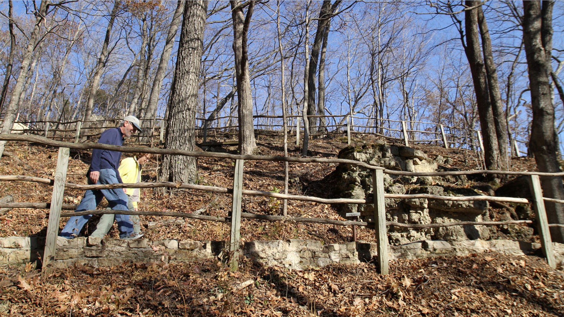 In this Nov. 8, 2010, file photo, pedestrians hike one of the trails at Effigy Mounds National Monument in Harpers Ferry, Iowa.