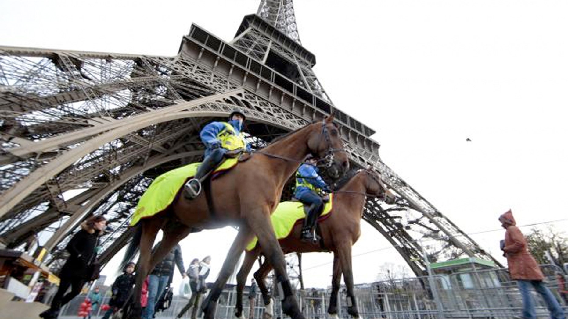 Police keep watch at Paris' Eiffel Tower.