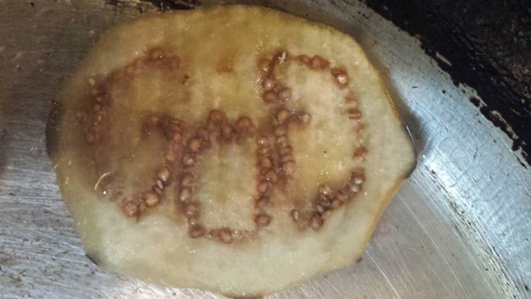 Jermarcus Brady was stunned after cutting into an eggplant to find the word GOD formed by the seeds.