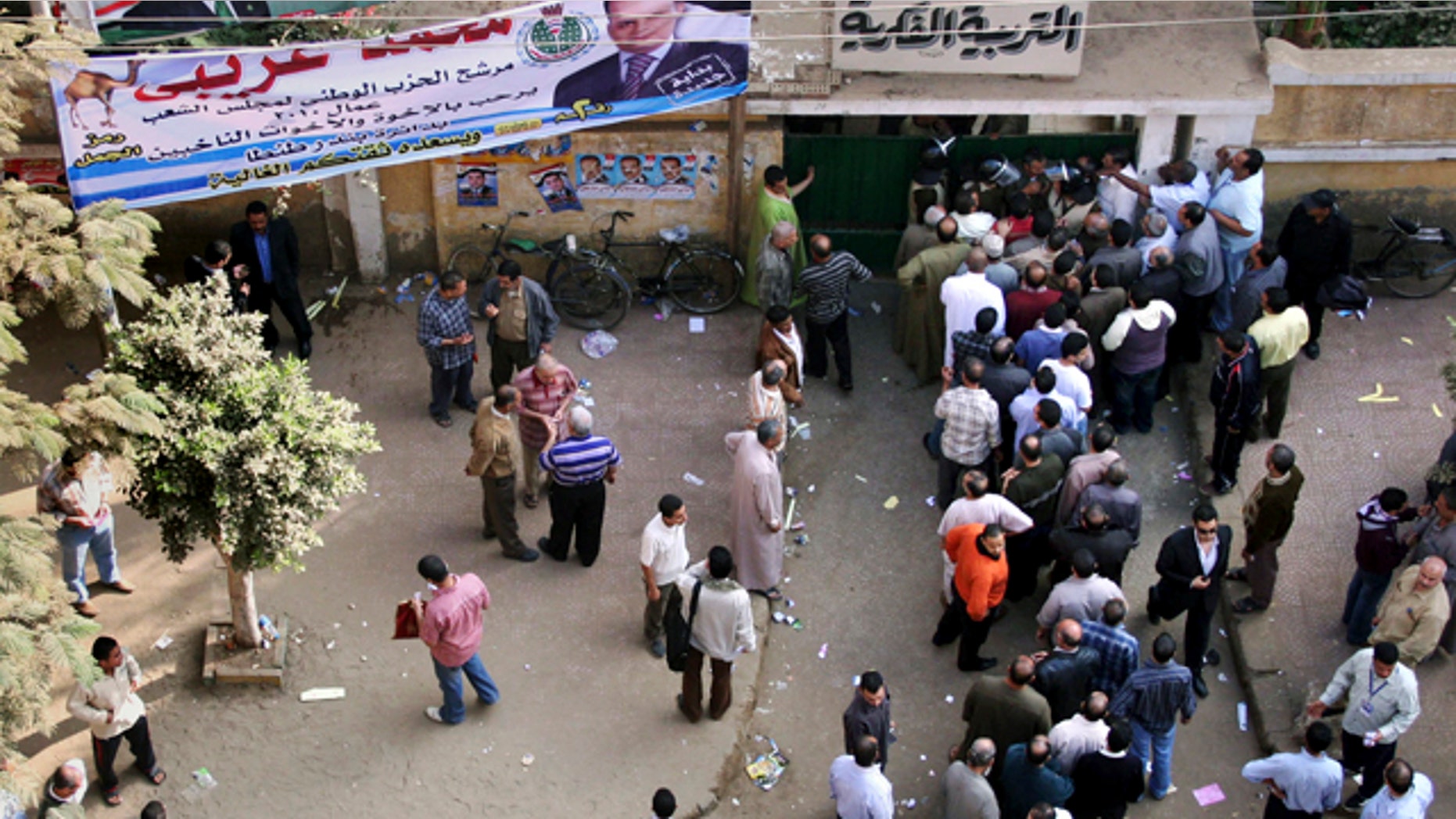 Nov. 28: Egyptians form a line outside a closed polling station in Tanta, north of Cairo, Egypt. Egyptians are choosing a new parliament amid uncertainty over the health of 82-year-old President Hosni Mubarak and widespread frustration over the lack of political reform and economic woes, following a campaign marred by a crackdown on dissent that was seen as an effort by the government to guarantee its powerful grip on authority ahead of a more crucial presidential vote due next year. (AP)
