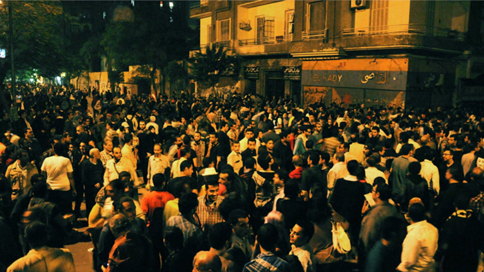 Nov. 19, 2012: Egyptian protesters gather during clashes with security forces, not pictured, in Cairo, Egypt.