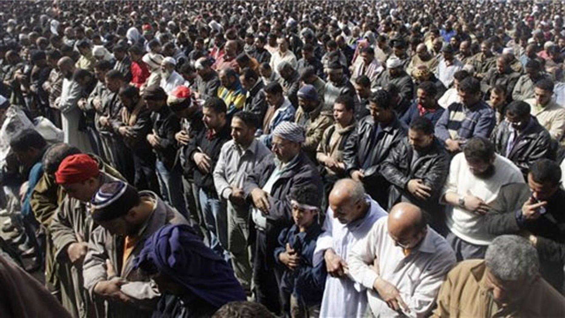 Anti-government protestors pray in Tahrir Square, in Cairo, Egypt, Feb. 4.