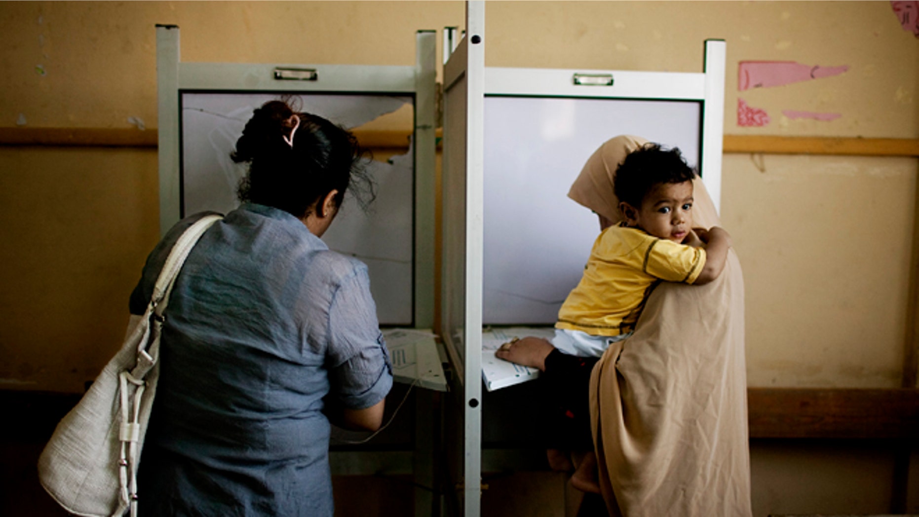 May 24, 2012: Female Egyptian voters cast their votes during the second day of presidential elections in the Mataraya neighborhood of Cairo, Egypt.