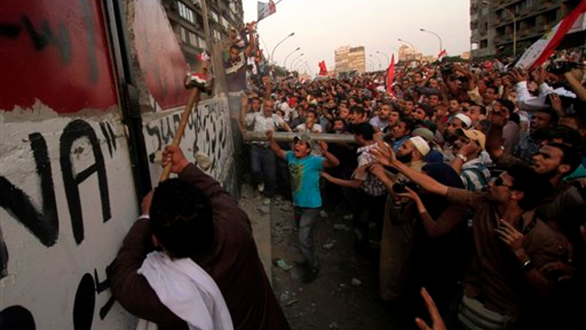 Sept. 9: Egyptians demolish a concrete wall built around a building housing the Israeli Embassy in Cairo, to protect it against demonstrators