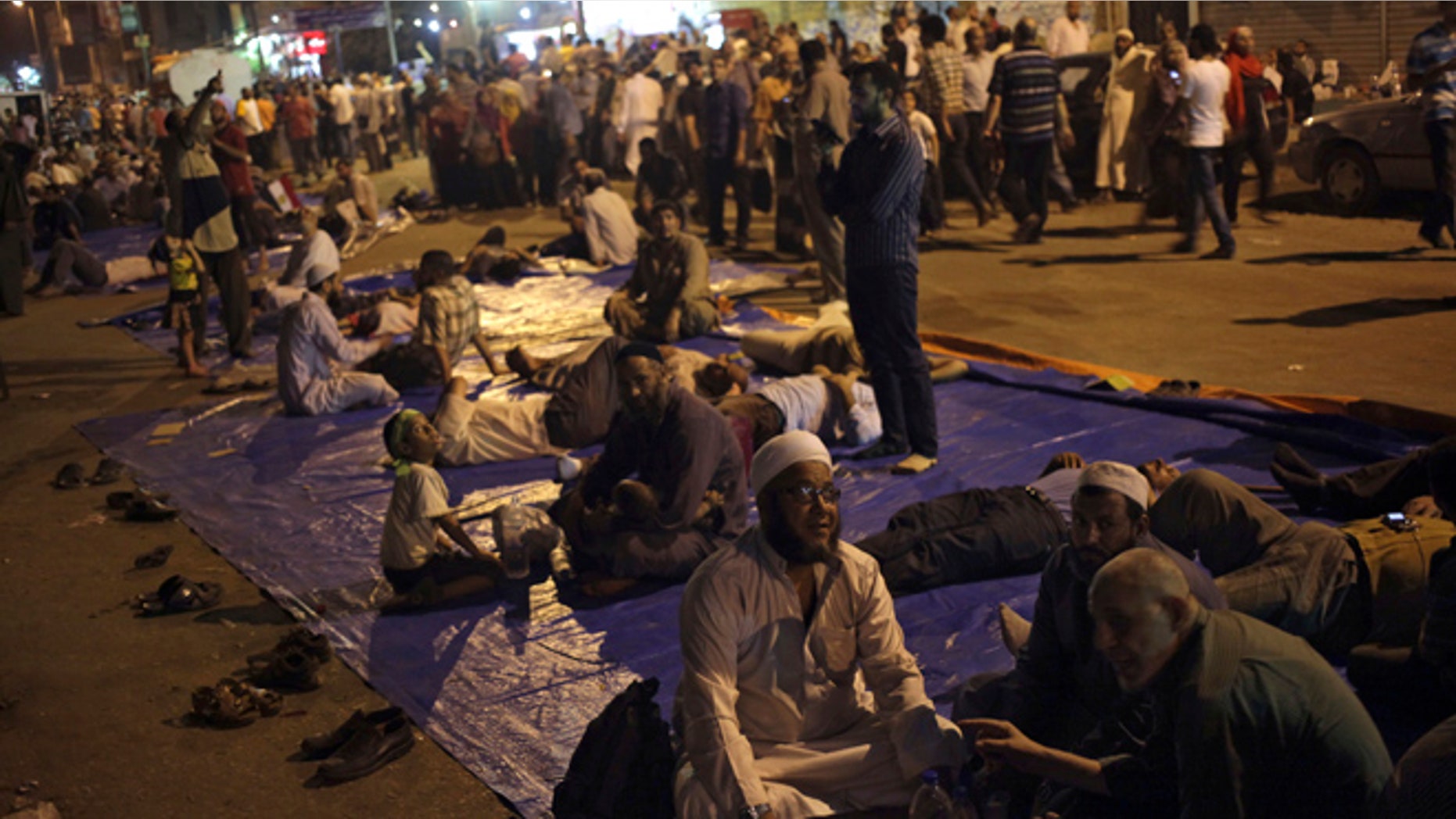 Aug. 2, 2013: Supporters of Egypt's ousted President Mohammed Morsi sit on a street as they protest near Cairo airport in Cairo, Egypt.