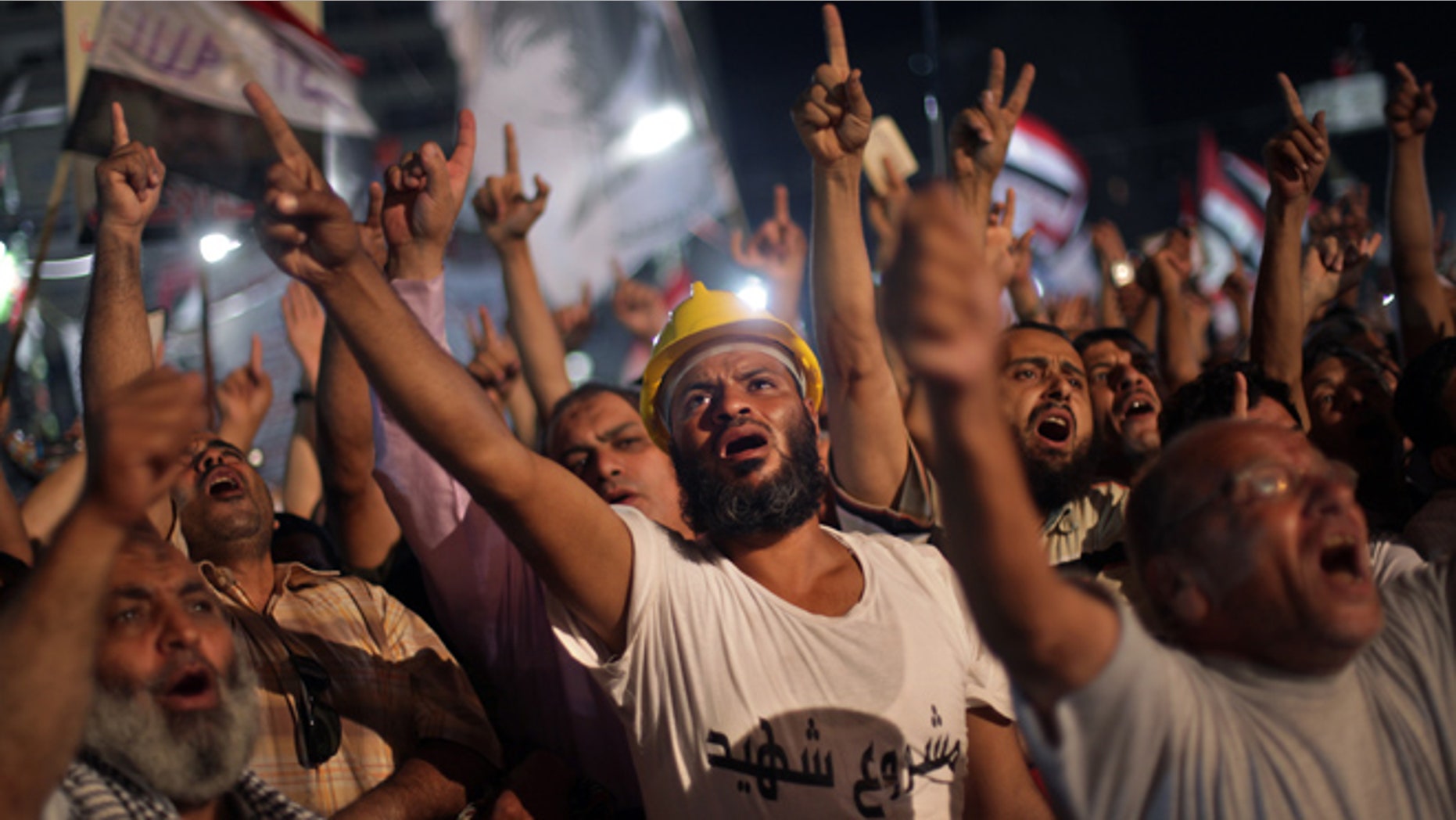 July 31, 2013: Supporters of Egypt's ousted President Mohammed Morsi chant slogans during a protest outside Rabaah al-Adawiya mosque, where they have installed a camp and hold daily rallies at Nasr City, in Cairo, Egypt, Wednesday.