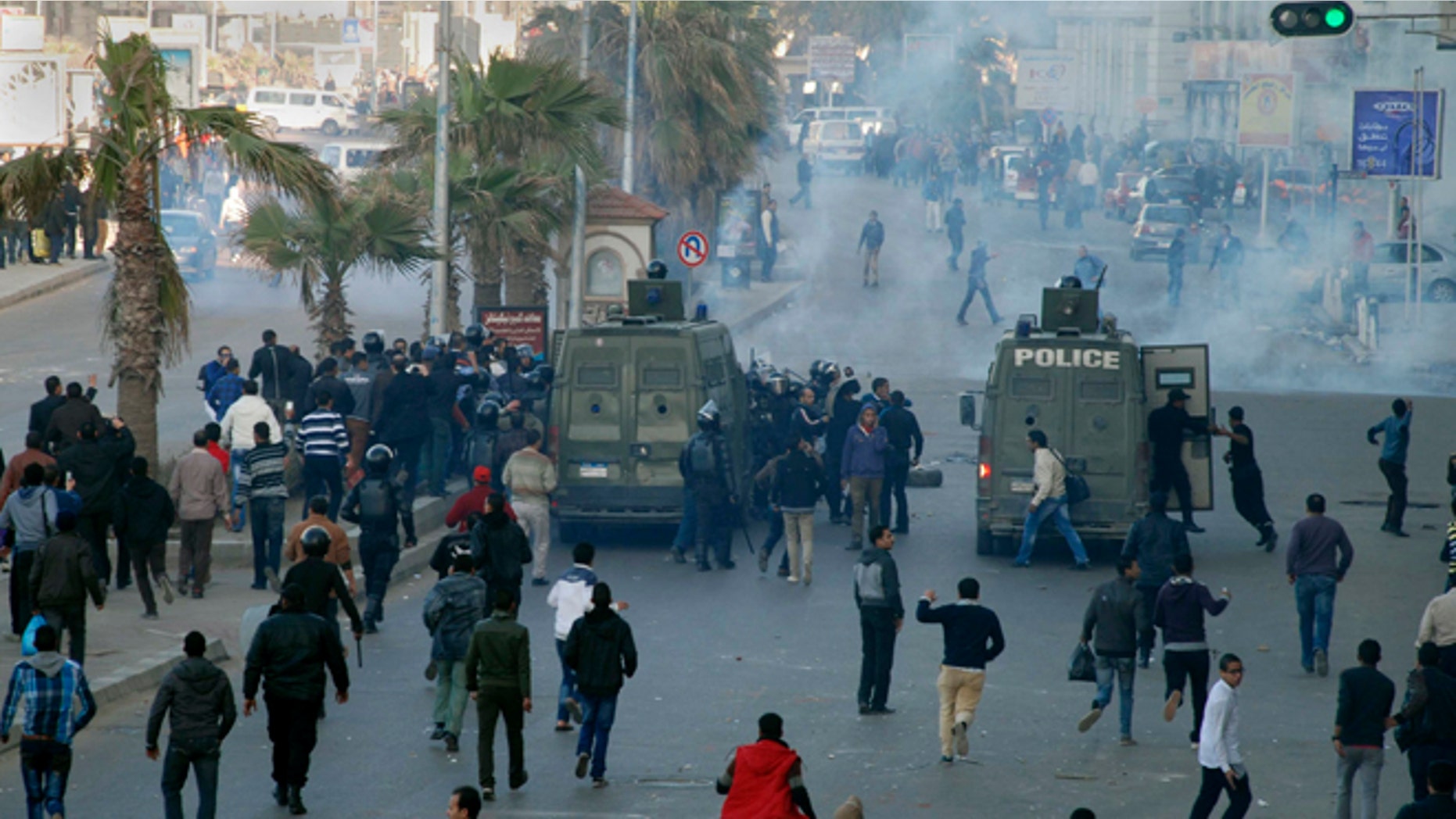Jan. 19, 2013: Egyptian police and protesters clash outside a courtroom in Alexandria, Egypt.