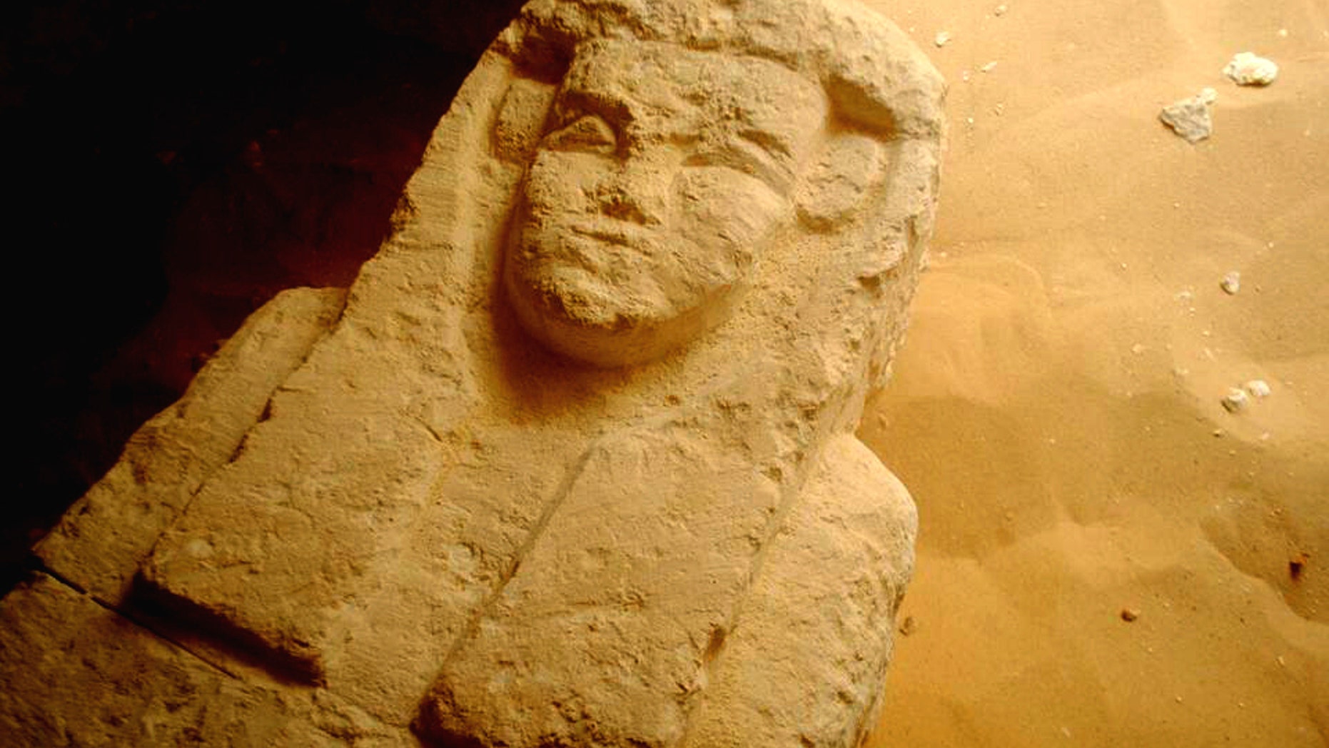 This undated photo released by the Egyptian Ministry of Antiquities shows a sarcophagi in a Ptolemaic tomb in an area known as al-Kamin al-Sahraw, in the Nile Valley province of Minya south of Cairo. Egypt's antiquities ministry says that archaeologists have discovered three tombs dating back more than 2,000 years, from the Ptolemaic Period. (Egyptian Ministry of Antiquities via AP)