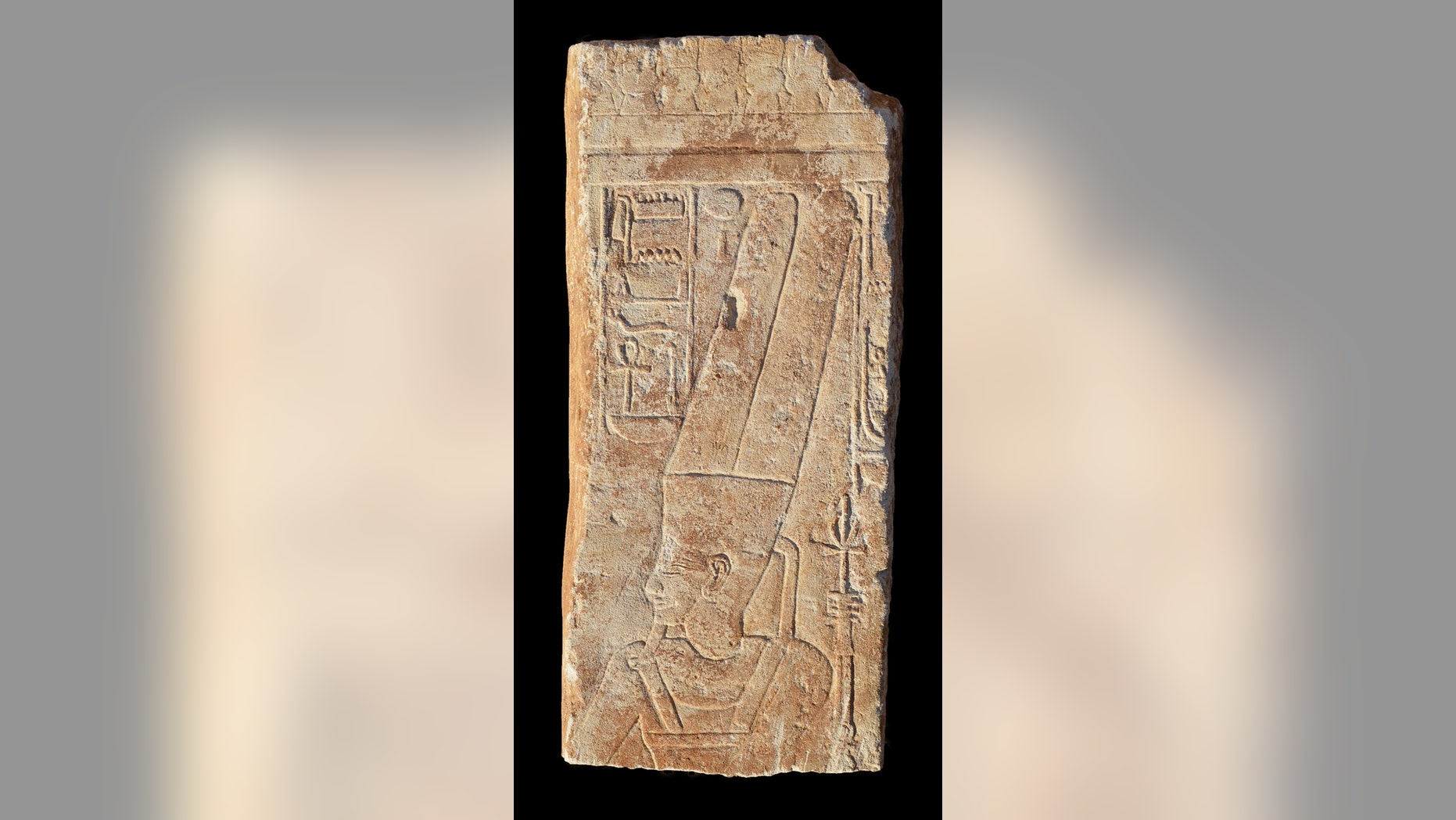 Here, the upper part of the Egyptian carving, showing the hieroglyph of Amun (top left); the hieroglyph and the god's face were hacked out on orders of pharaoh Akhenaten (reign 1353-1336 B.C) and were later restored.