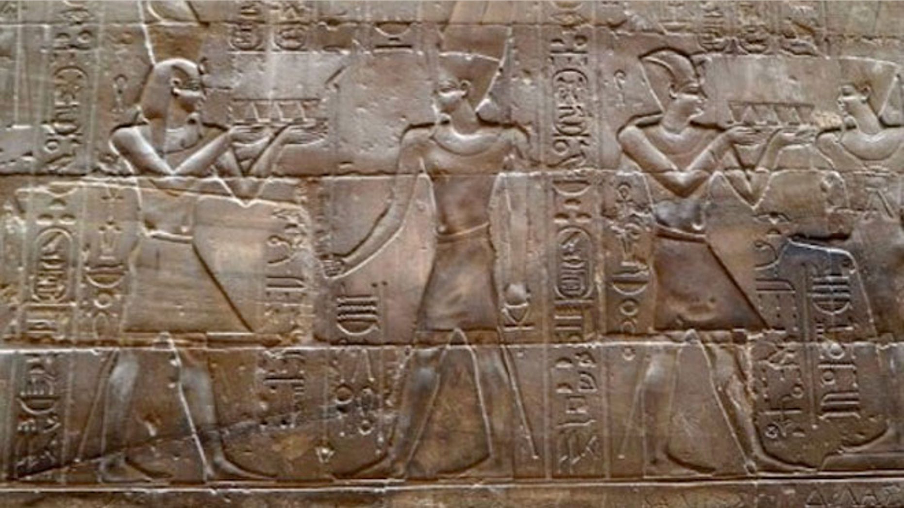 The damaged panel depicting Alexander the Great in a temple in Luxor. Egyptian restoration experts haven since managed to remove graffiti from an ancient monument after it had been defaced by a Chinese tourist.