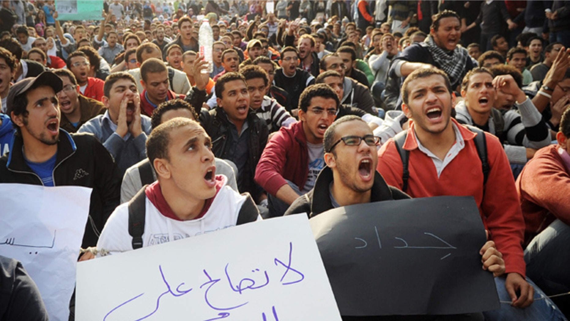 Dec. 21: Egyptian men chant slogans during a protest demanding the military step down in Cairo.