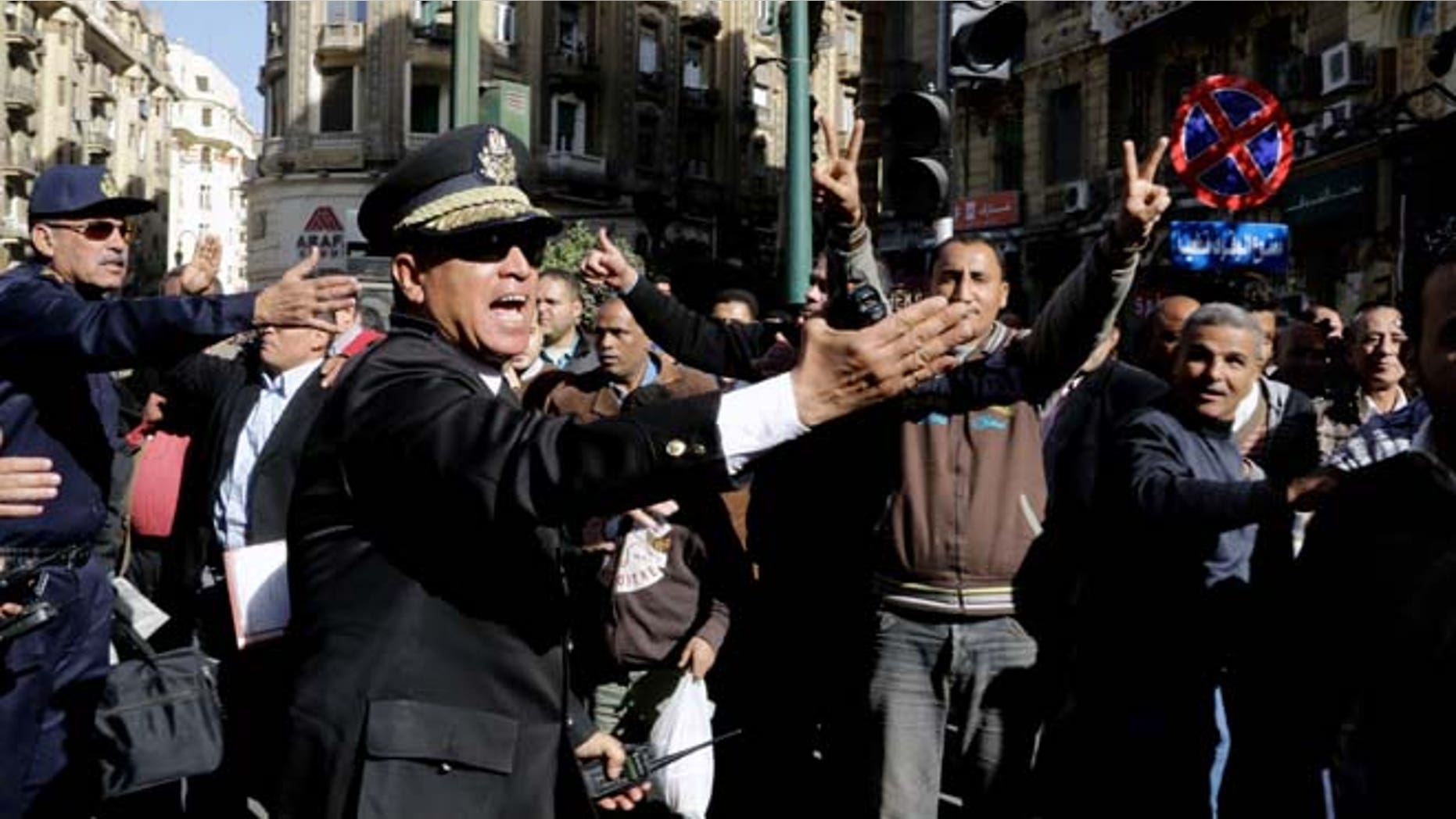 Jan. 29, 2015: Egyptian police try to clear the street where women rally at the spot where Shaimaa el-Sabbagh, a 32-year-old mother, was shot in downtown Cairo on Saturday near Talaat Harb Square, during a protest in Cairo, Egypt. (AP)