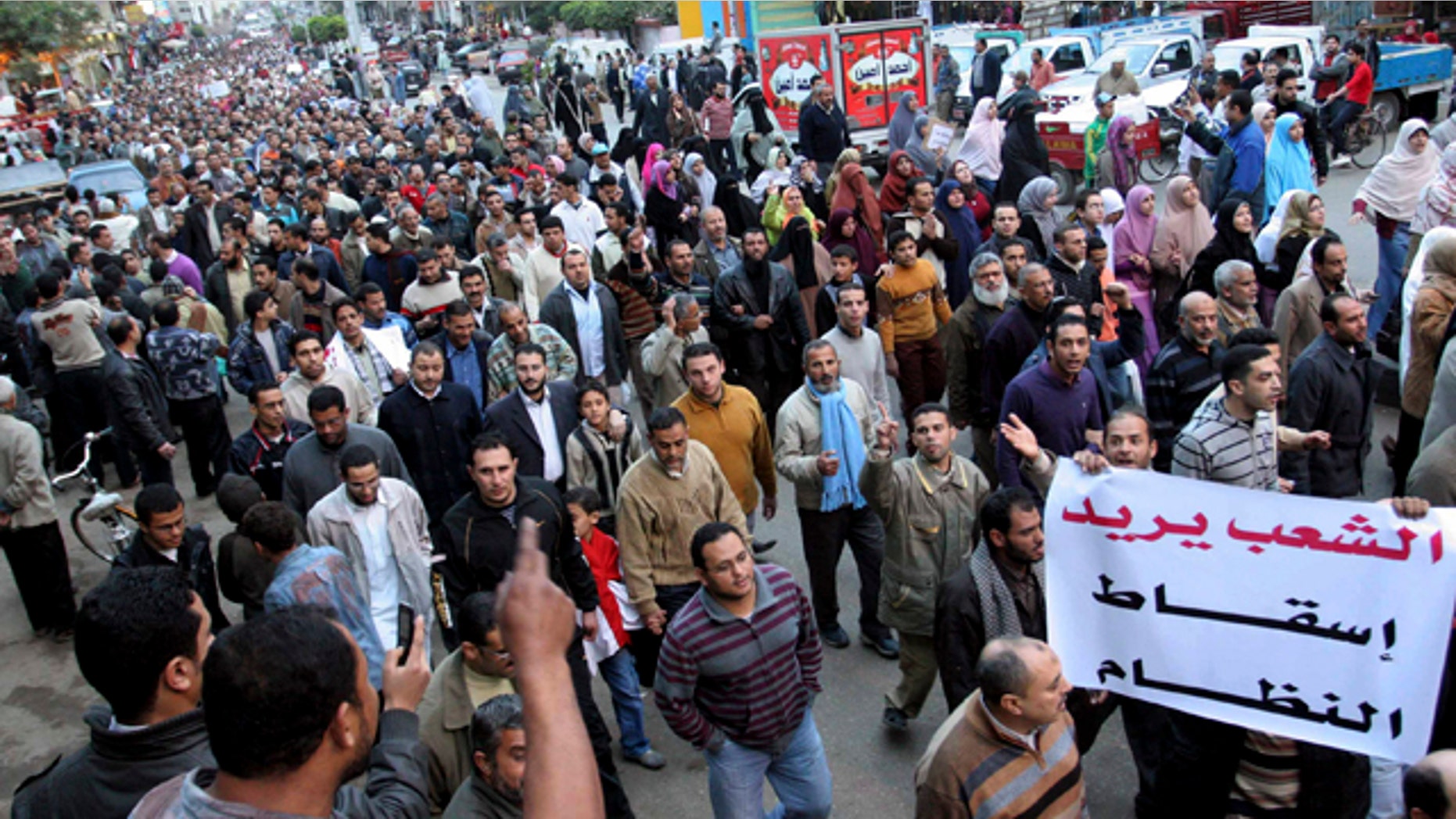 Feb. 6, 2011: Egyptian anti-Mubarak protesters march in al Mansoura city, Egypt.