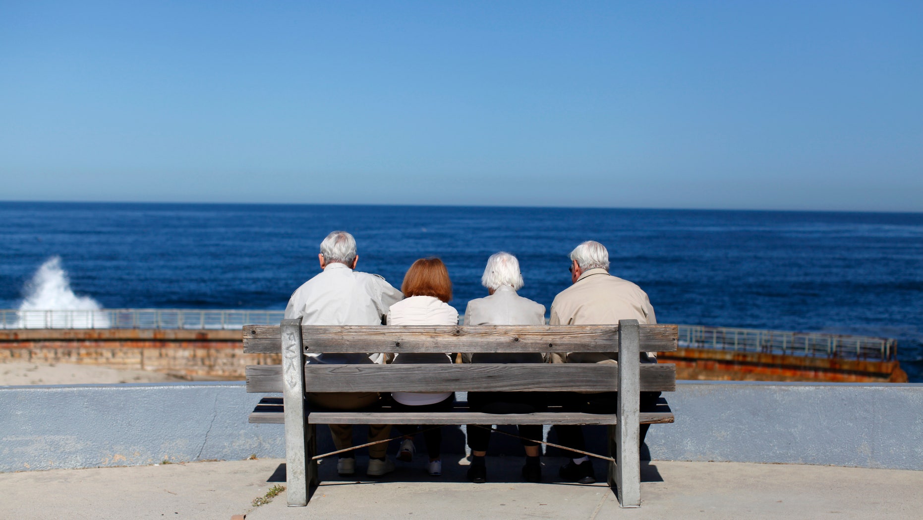 A pair of elderly couples view the ocean and waves along the beach in La Jolla, California March 8, 2012. (REUTERS/Mike Blake)
