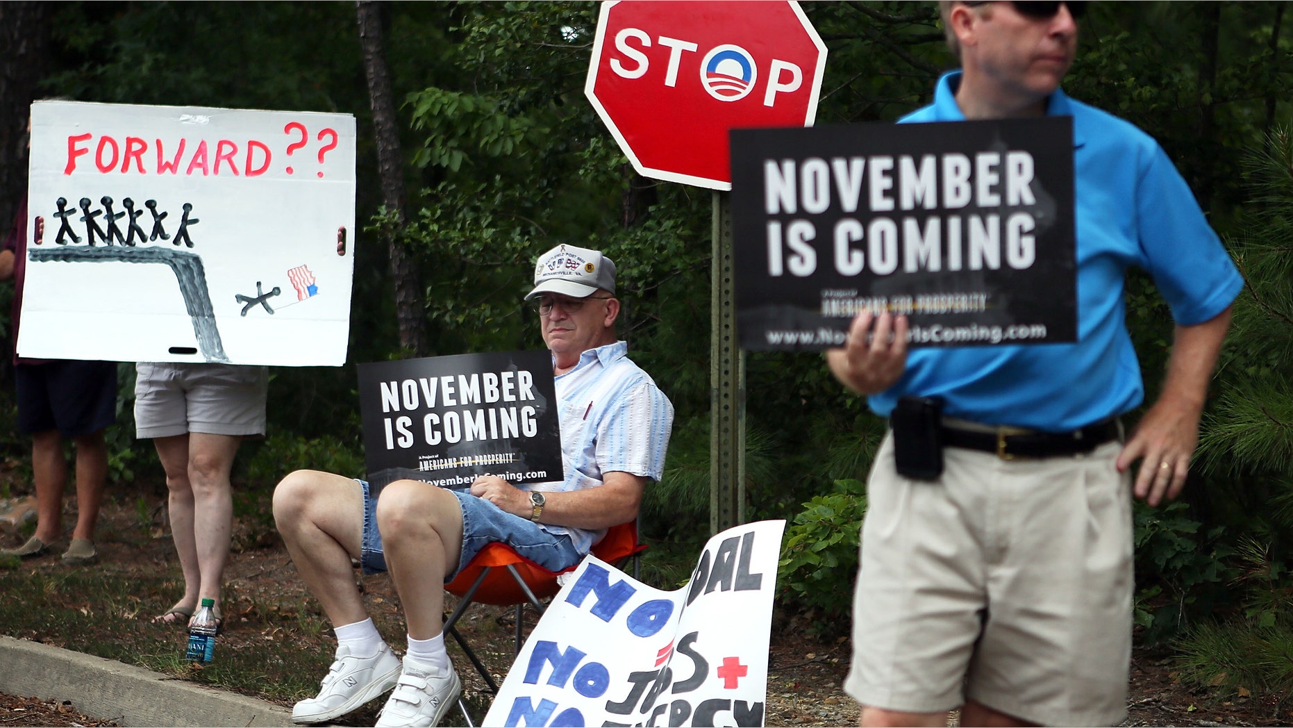 GLEN ALLEN, VA - JULY 14: Conservative local residents protest prior to U.S. President Barack Obama's ''A Vision for Virginia's Middle Class'' campaign event July 14, 2012 at Walkerton Tavern in Glen Allen, Virginia. On the last day of his two-day campaign across Virginia, Obama continue to discuss his plan to restore middle class security and urged the Congress to act on extending tax cuts to middle class families. (Photo by Alex Wong/Getty Images)