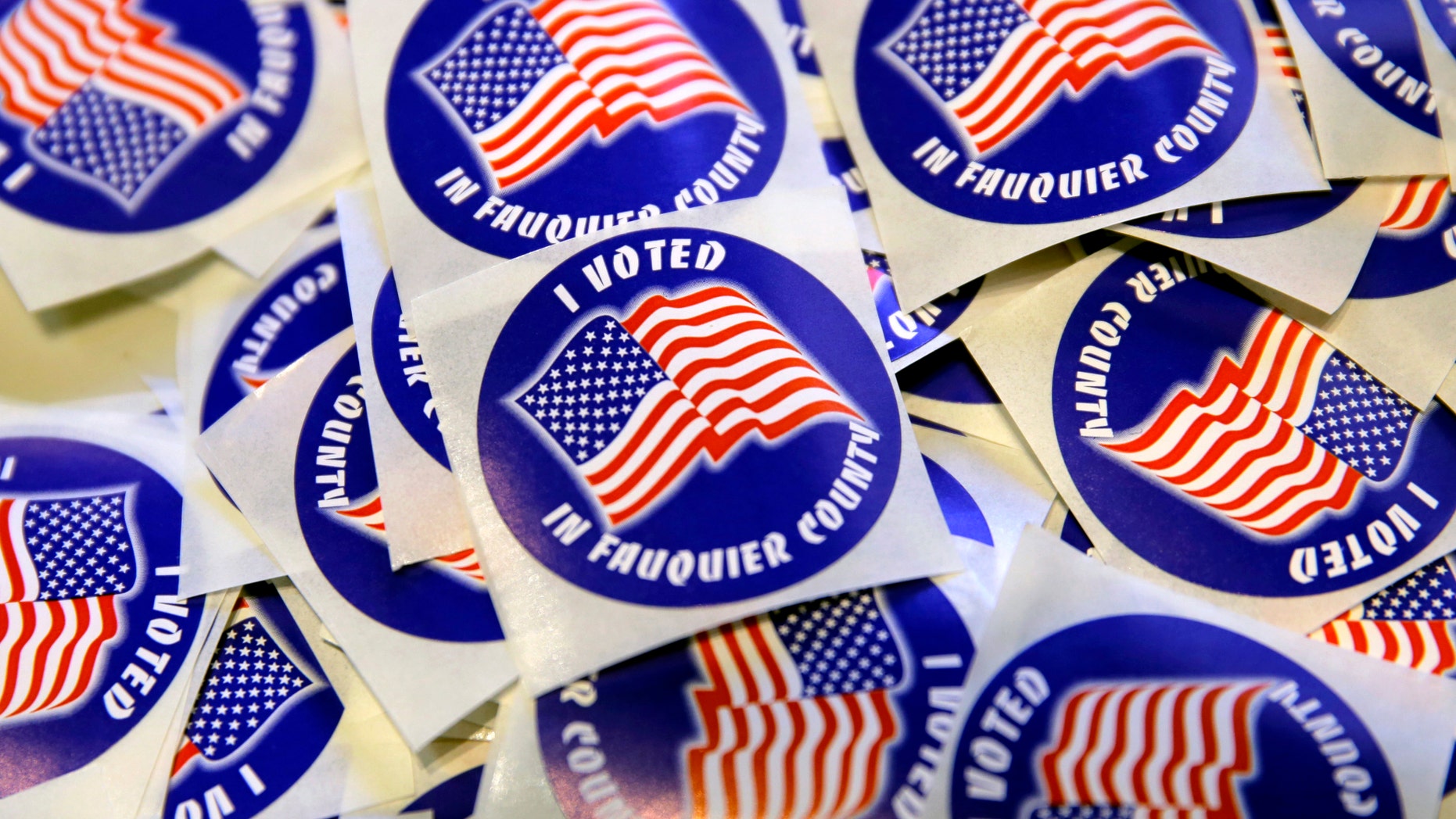"I voted" stickers are on display for voters in the U.S. presidential election at Grace Episcopal Church in The Plains, Virginia, U.S., Nov. 8, 2016. (REUTERS/Joshua Roberts)