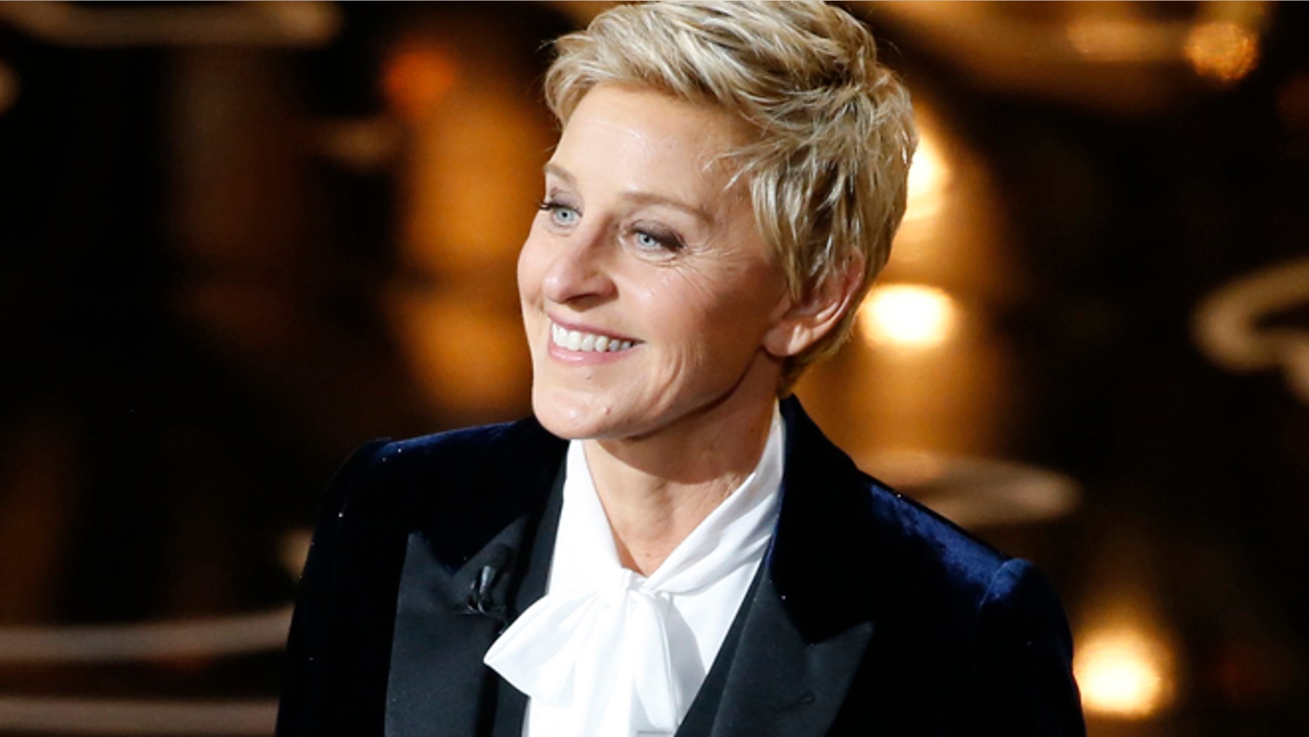 The principal of a Catholic elementary school in suburban Philadelphia is apologizing to parents for using a photo of Ellen DeGeneres, whom he called a 'poor role model.'