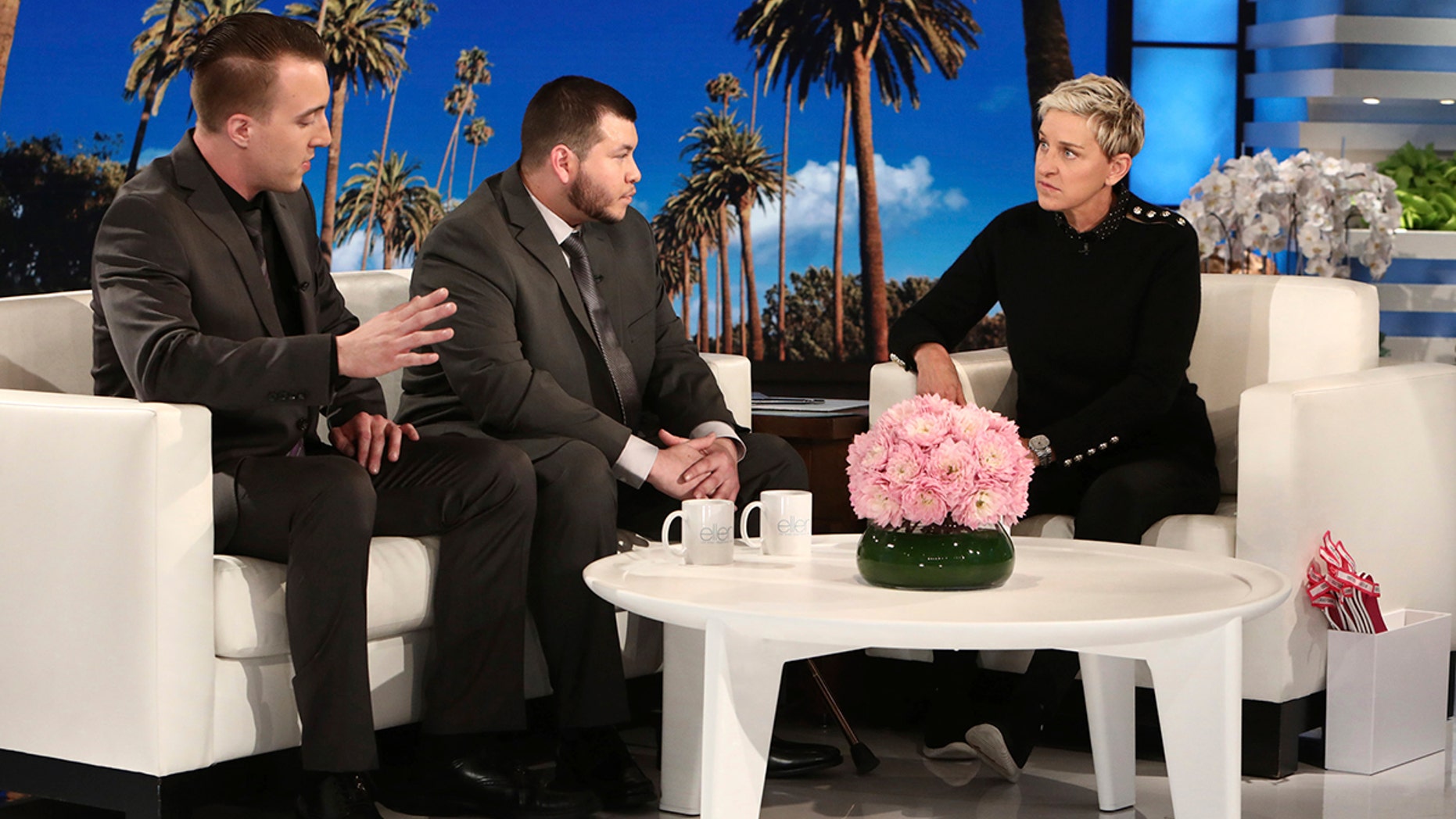 Las Vegas hotel employees Stephen Schuck, left, and Jesus Campos talk with TV host Ellen DeGeneres during a show taped earlier this month.