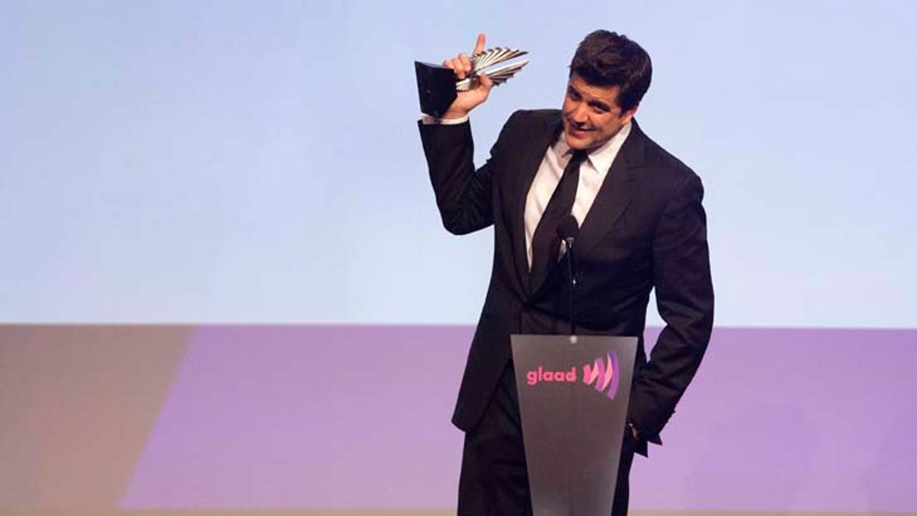 News anchor Josh Elliott accepts an award for Outstanding Journalism TV at the 23rd Annual at the 23rd annual Gay and Lesbian Alliance Against Defamation (GLAAD) Media Awards in New York March 24, 2012. REUTERS/Andrew Kelly (UNITED STATES - Tags: ENTERTAINMENT PROFILE) - RTR2ZUA0