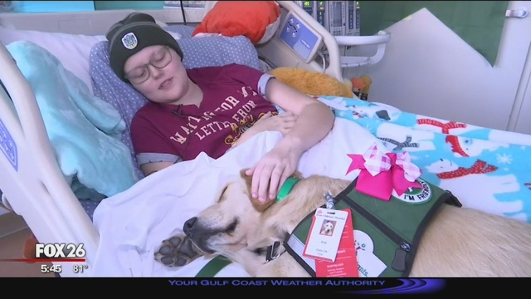 Elsa snuggles up to a patient during her rounds.