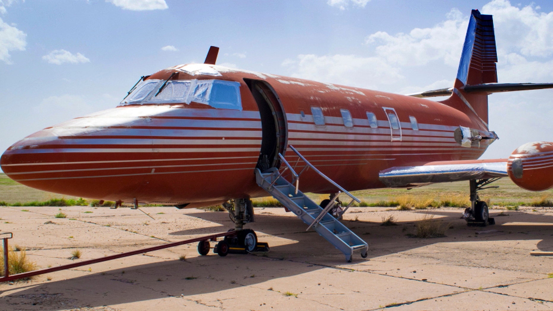 This undated file photo provided by GWS Auctions, Inc. shows a private jet once owned by Elvis Presley, on a runway in New Mexico.