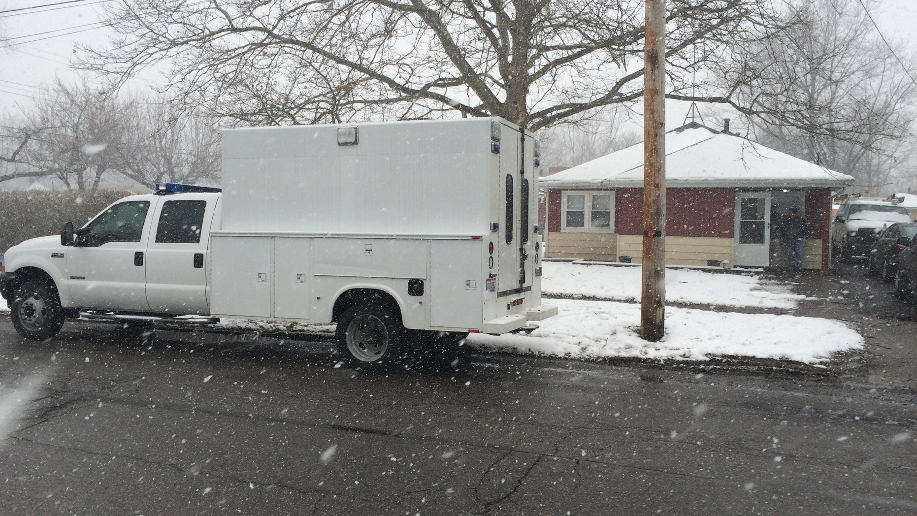 Investigators at the home in Elyria.