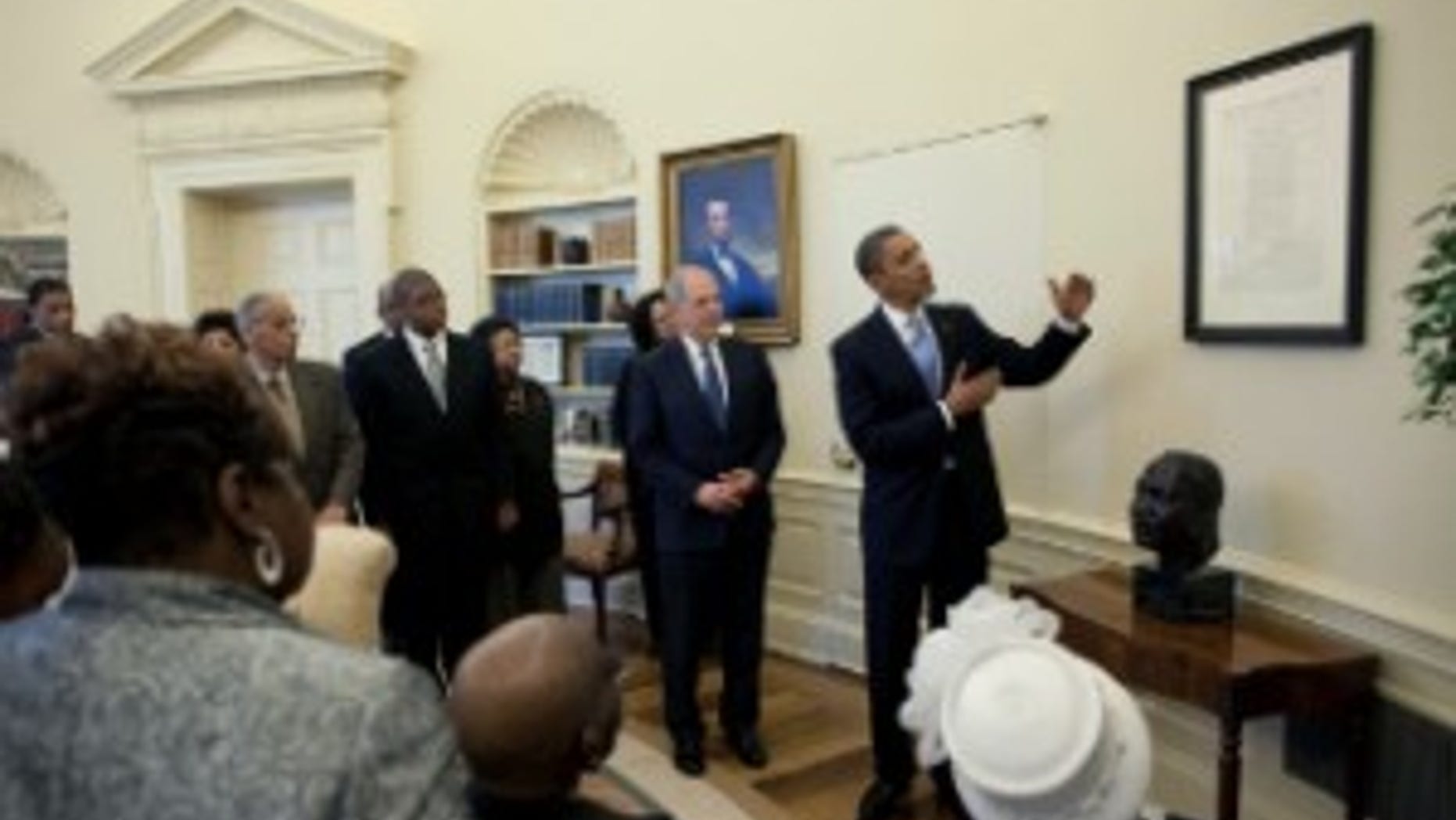 President Obama shows off the Emancipation Proclamation. White House Photo.