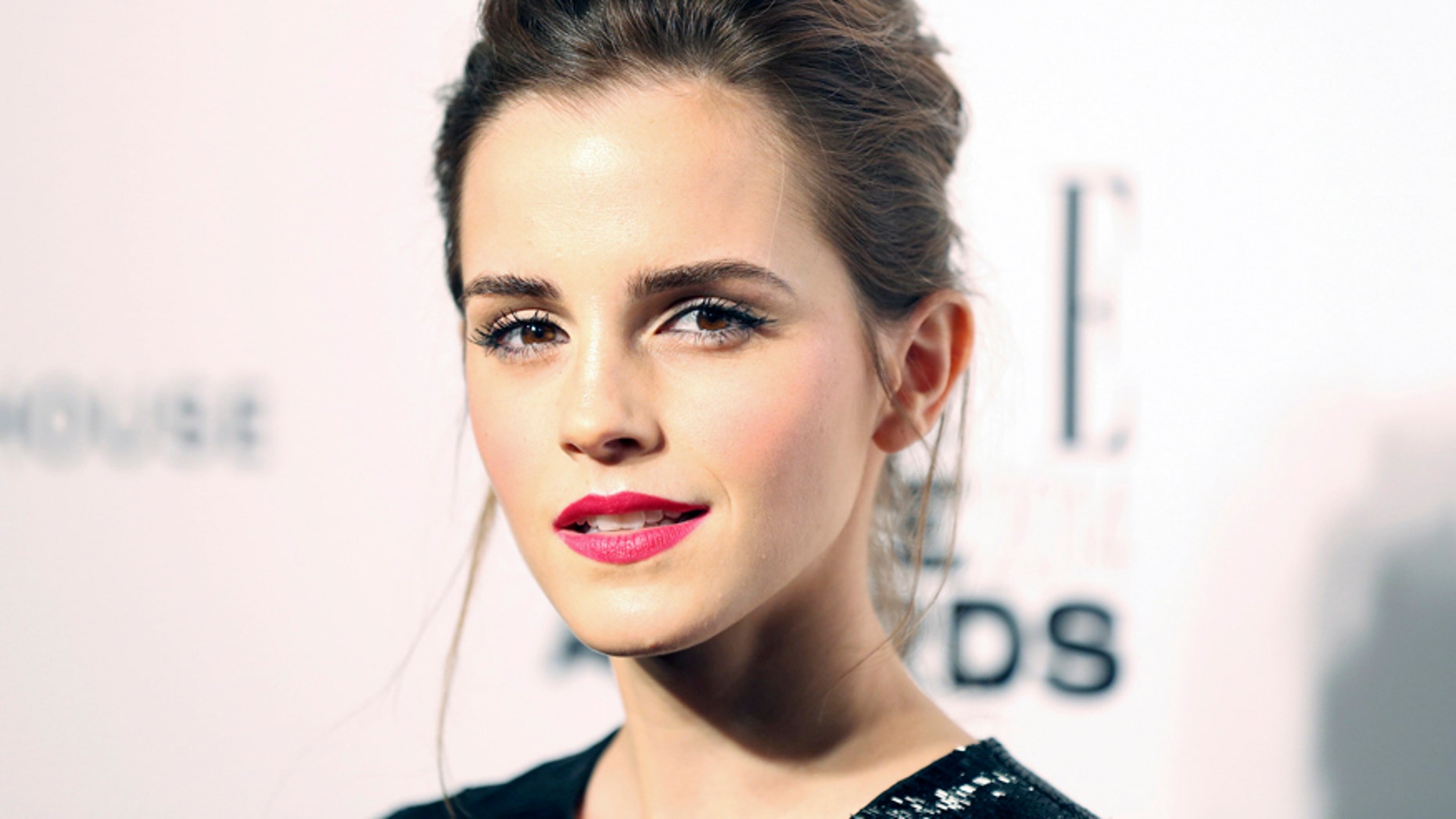 Actress Emma Watson arrives at the Elle Style Awards in London, February 18, 2014. REUTERS/Paul Hackett (BRITAIN - Tags: ENTERTAINMENT) - RTX192QR