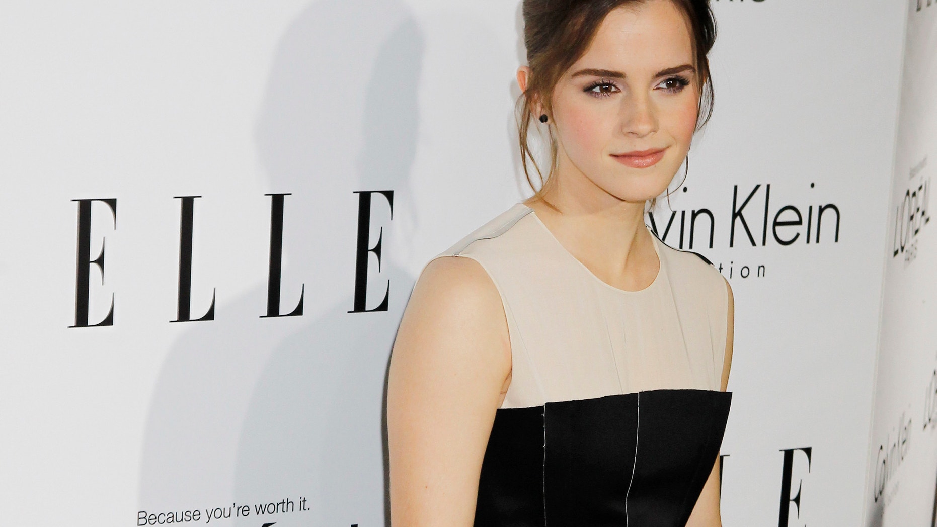 Honoree Emma Watson poses as she arrives at the 19th Annual ELLE Women in Hollywood dinner in Beverly Hills, California October 15, 2012. The event honors women who have had a profound impact on the film industry.