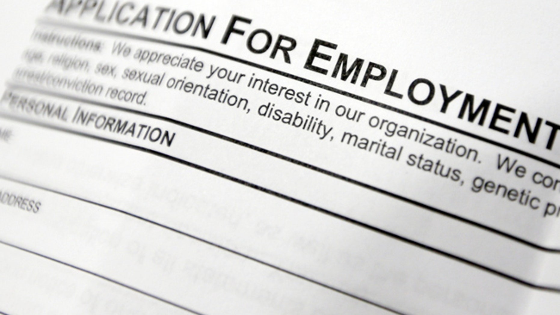 FILE - This April 22, 2014, file photo shows an employment application form on a table at a job fair in Hudson, N.Y. Middle-age white Americans with limited education are increasingly dying younger, on average, than other middle-age U.S. adults, a trend driven by their dwindling economic opportunities, research by two Princeton University economists has found. The economists, Anne Case and Angus Deaton, argue in a paper released Thursday, March 23, 2017, that the loss of steady middle-income jobs for those with high school degrees or less has triggered broad problems for this group. (AP Photo/Mike Groll, File)