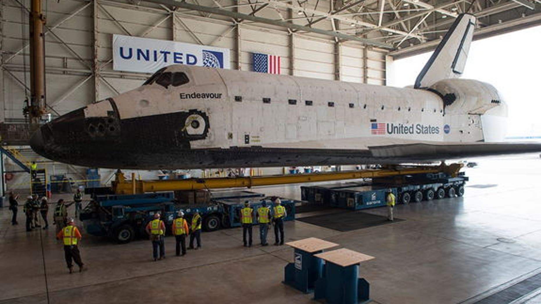 Space shuttle Endeavour is seen atop the Over Land Transporter in a hangar at Los Angeles International Airport.