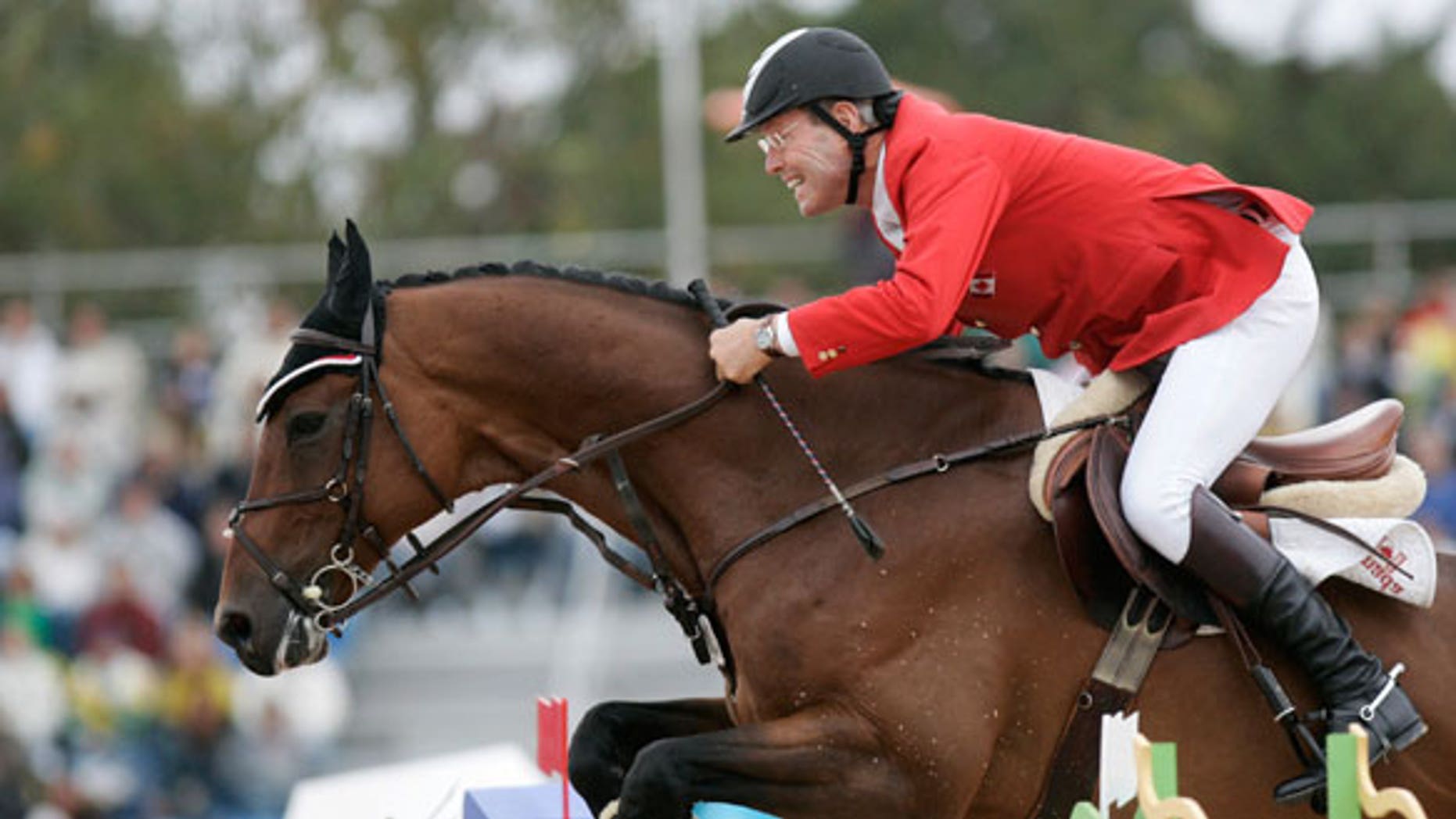 July 29, 2007: Canada's Ian Millar rides "In Style" during the final jumping competition at the Pan American Games in Rio de Janeiro.