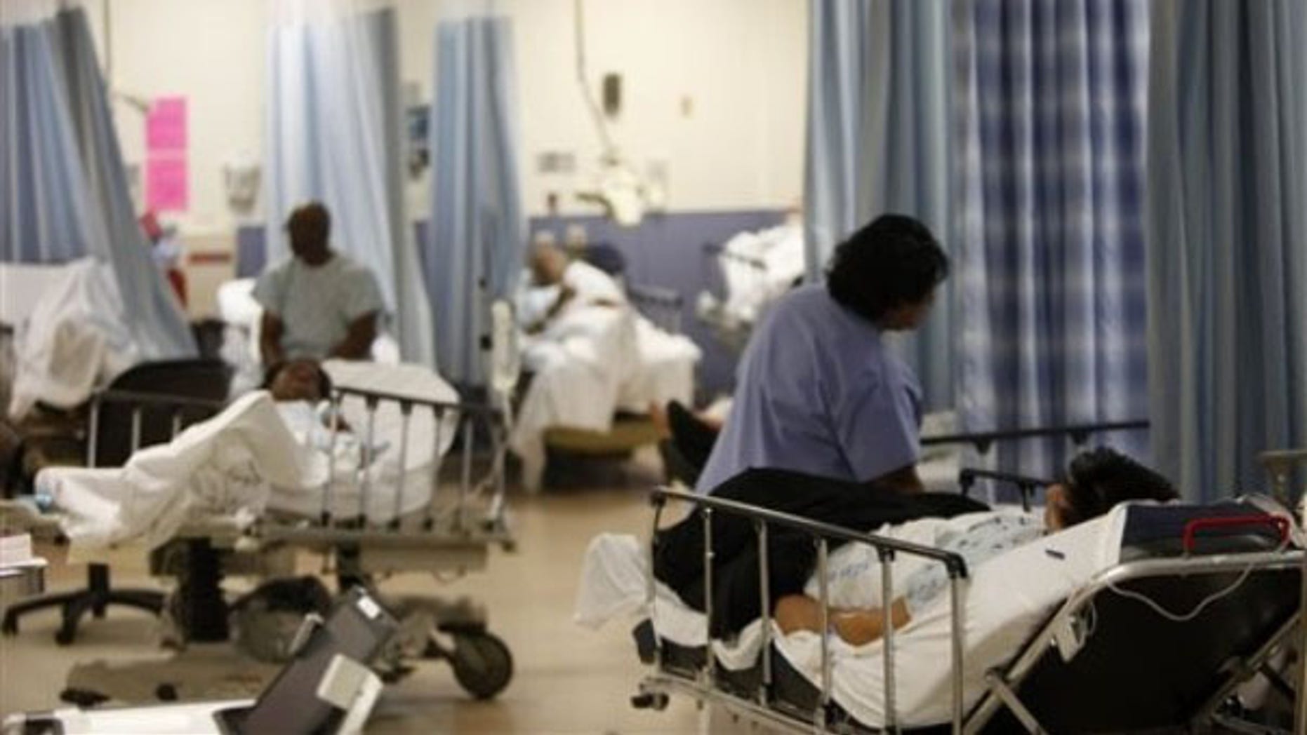 Patients are cared for at the emergency room at Jamaica Hospital in New York March 22. (AP Photo)